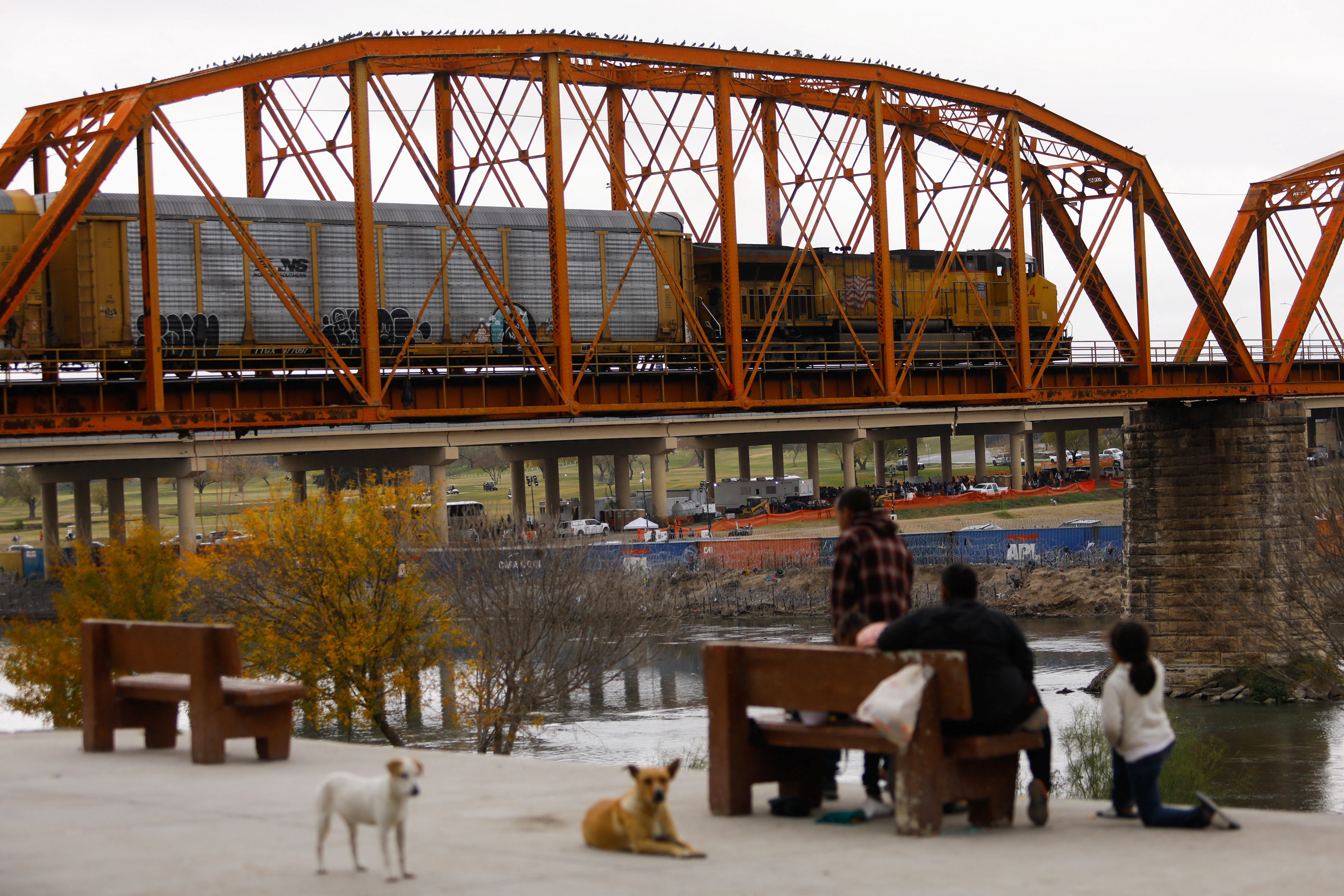 A freight train crosses the border between Mexico and the United States after a five-day suspension due to U.S. authorities closing railway bridges in Eagle Pass and El Paso, Texas, in order to redirect personnel to stop an increase in the migration, in Piedras Negras, Cohauila, Mexico December 22, 2023. 