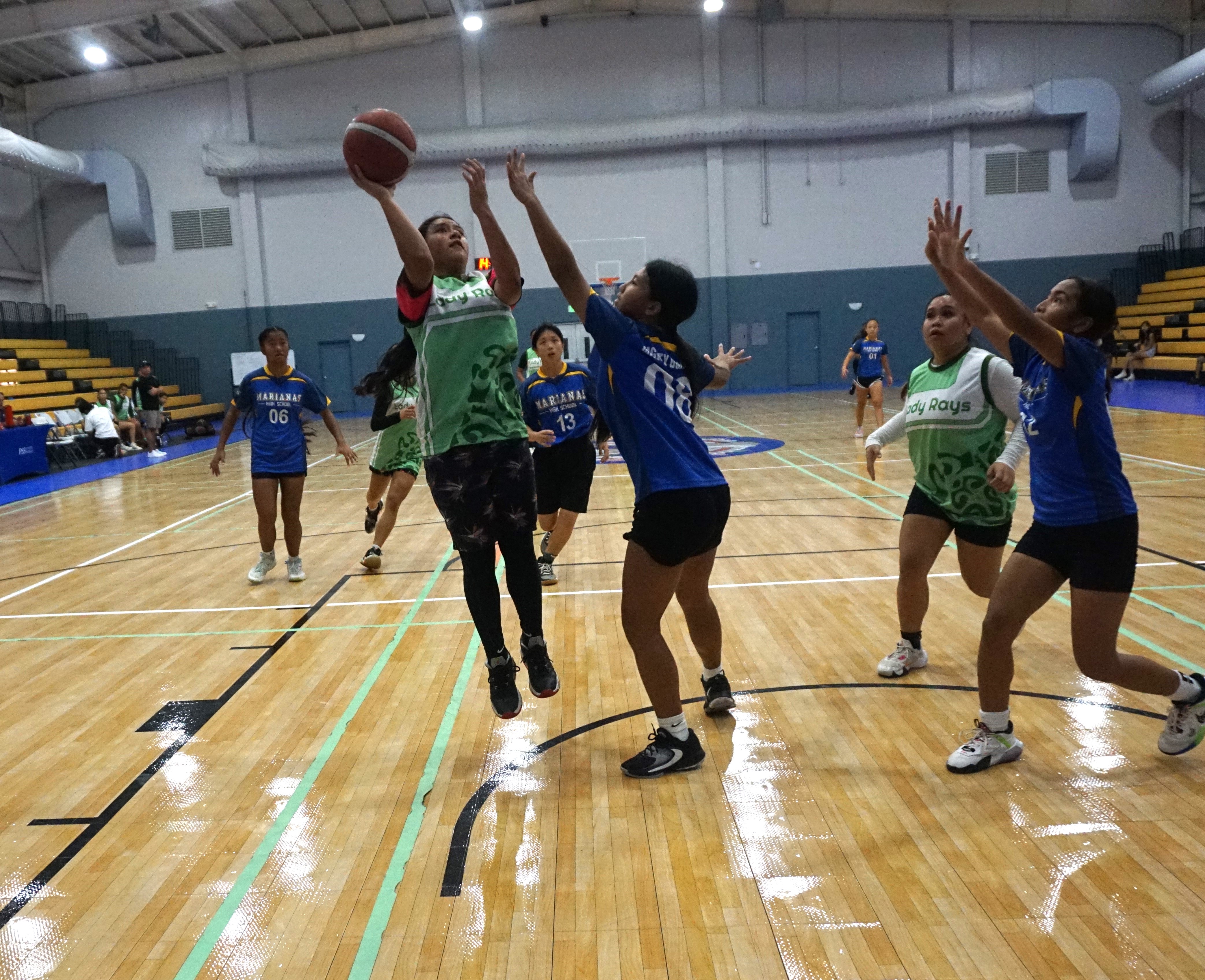 SSHS' Rosie Saralu takes the fadeaway jumper over a defender.