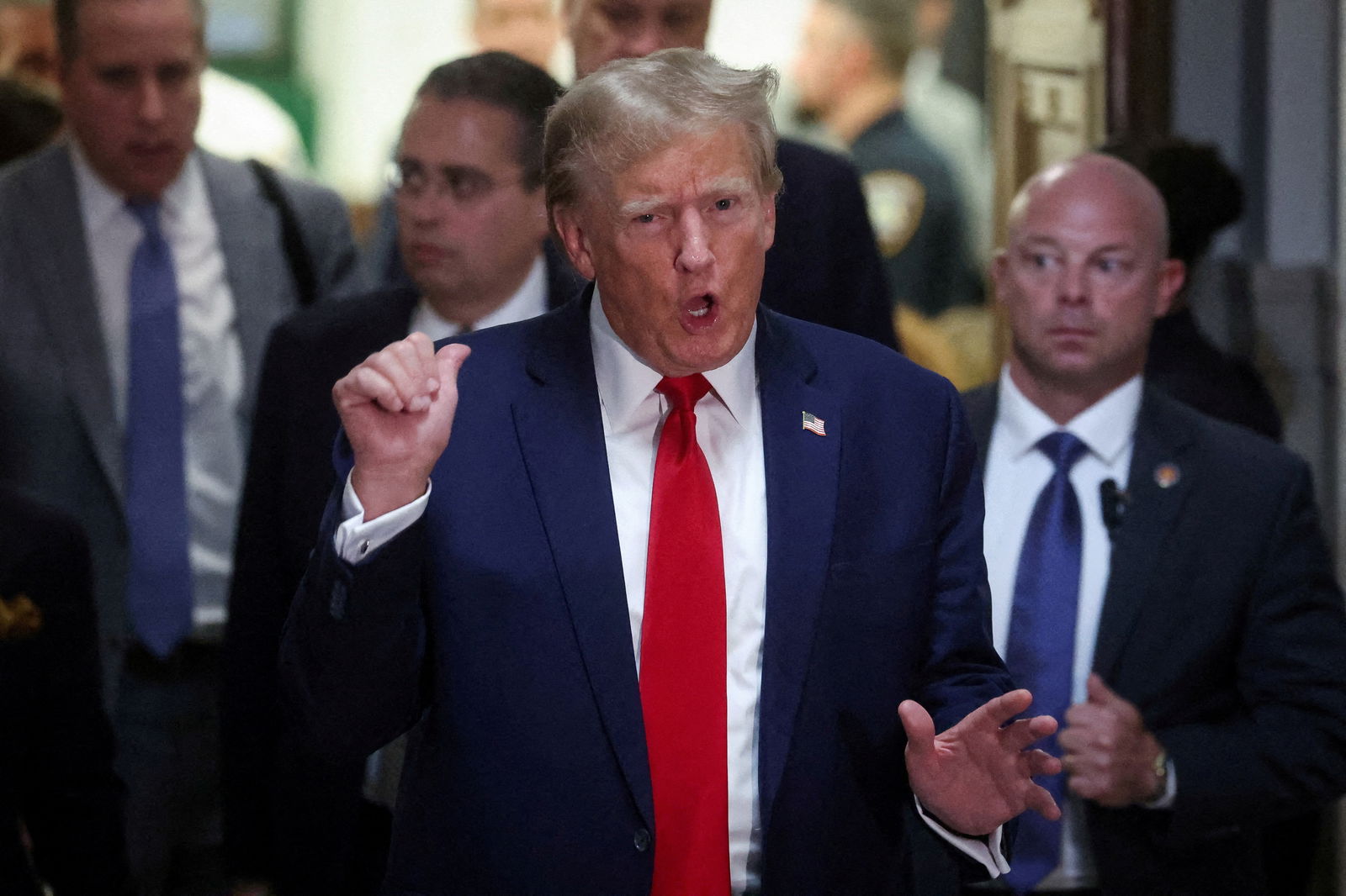 Former U.S. President Donald Trump gestures while leaving the courtroom during a break, as he attends the Trump Organization civil fraud trial, in New York State Supreme Court in the Manhattan borough of New York City, U.S., December 7, 2023. 