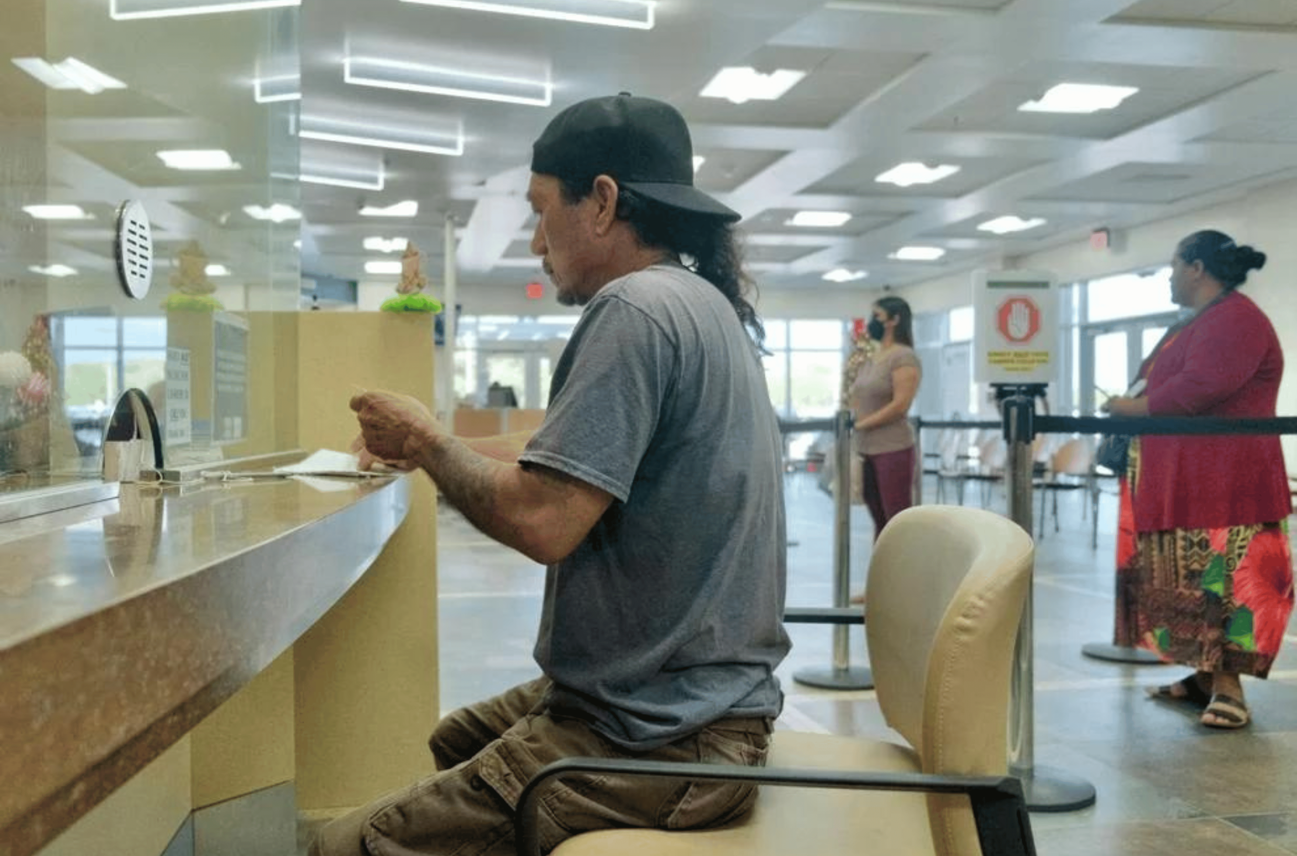 Chalan Pago resident Vincent Takashy pays his power bill at the Gloria B. Nelson Public Service Building in Mangilao on Thursday, Dec. 28, 2023. 