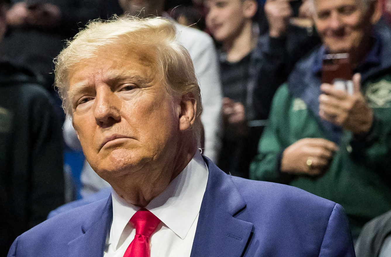 Former President Donald Trump greets fans as he arrives before the finals of the NCAA Division I Wrestling Champion- ships at BOK Center in Tulsa, Oklahoma, March 18, 2023. Photo by Brett Rojo/ USA TODAY Sports via REUTERS
