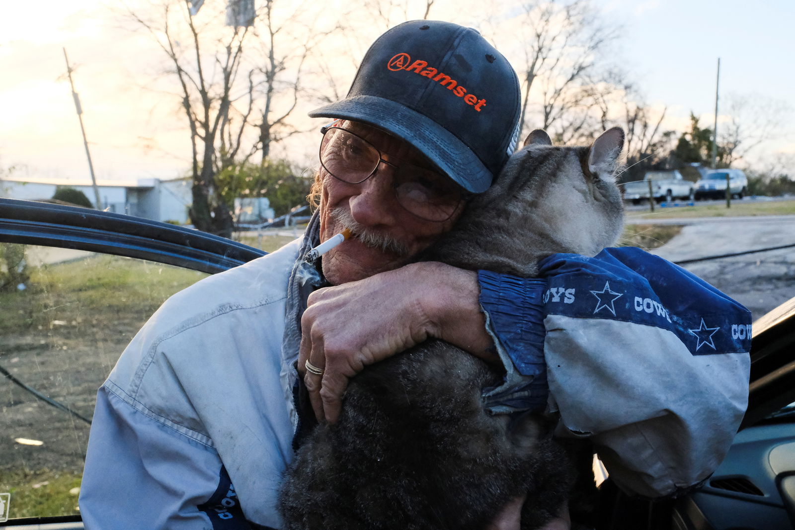 Greg Chance hugs his cat a day after a tornado hit Madison, Tennessee, U.S., December 10, 2023. 
