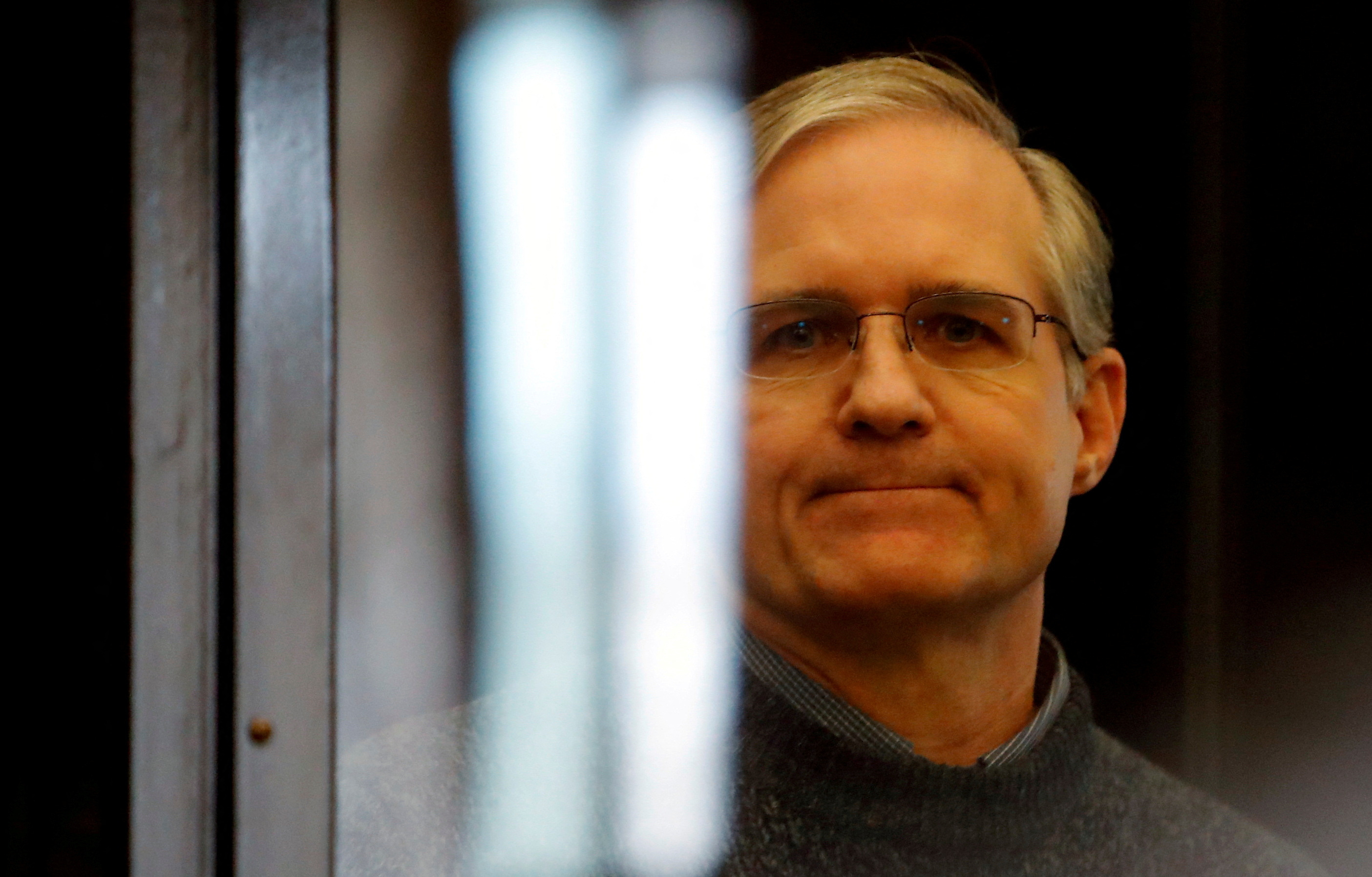 Former U.S. Marine Paul Whelan, who was detained and accused of espionage, stands inside a defendants' cage during his verdict hearing in Moscow, Russia June 15, 2020. 
