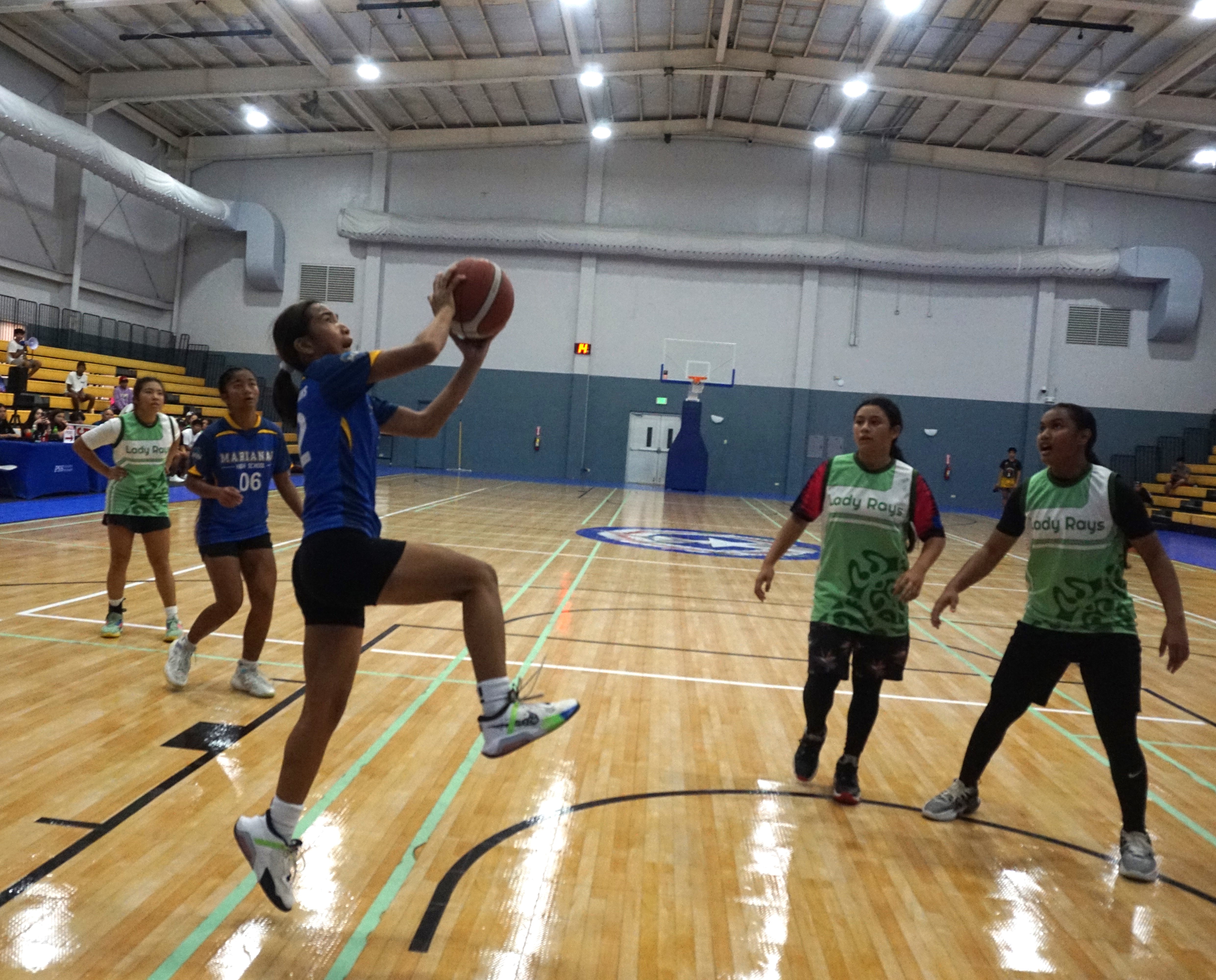 MHS' Valerie Estella goes up for the finish.