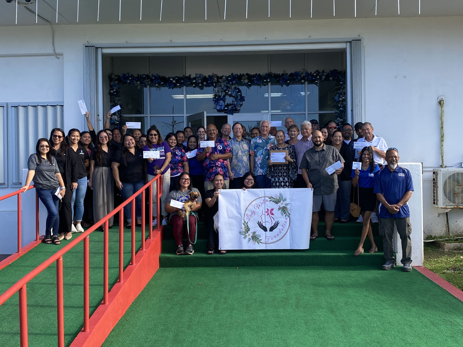 Representatives of the nonprofit organization sector pose with first lady Wella Palacios, Gov. Arnold Palacios, Bridge Capital LLC executives Shawn Scott, John Baldwin and Bart Jackson.