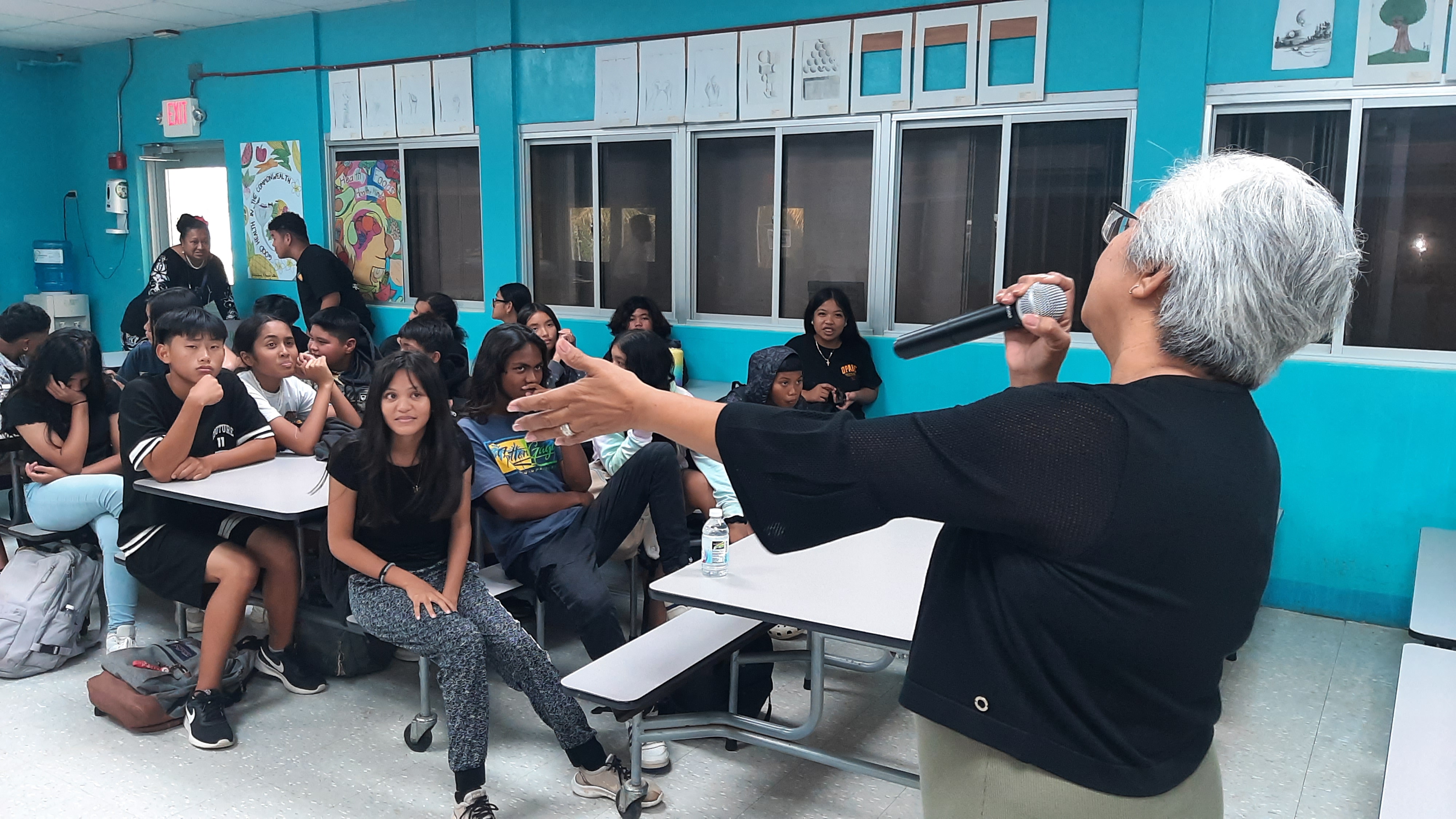 Marianas Tourism Education Council Chairwoman Vicky Benavente teaches about tourism at Francisco M. Sablan Middle School during the educational outreach presentation of MTEC and the Marianas Visitors Authority on Dec. 12, 2023, at the school.