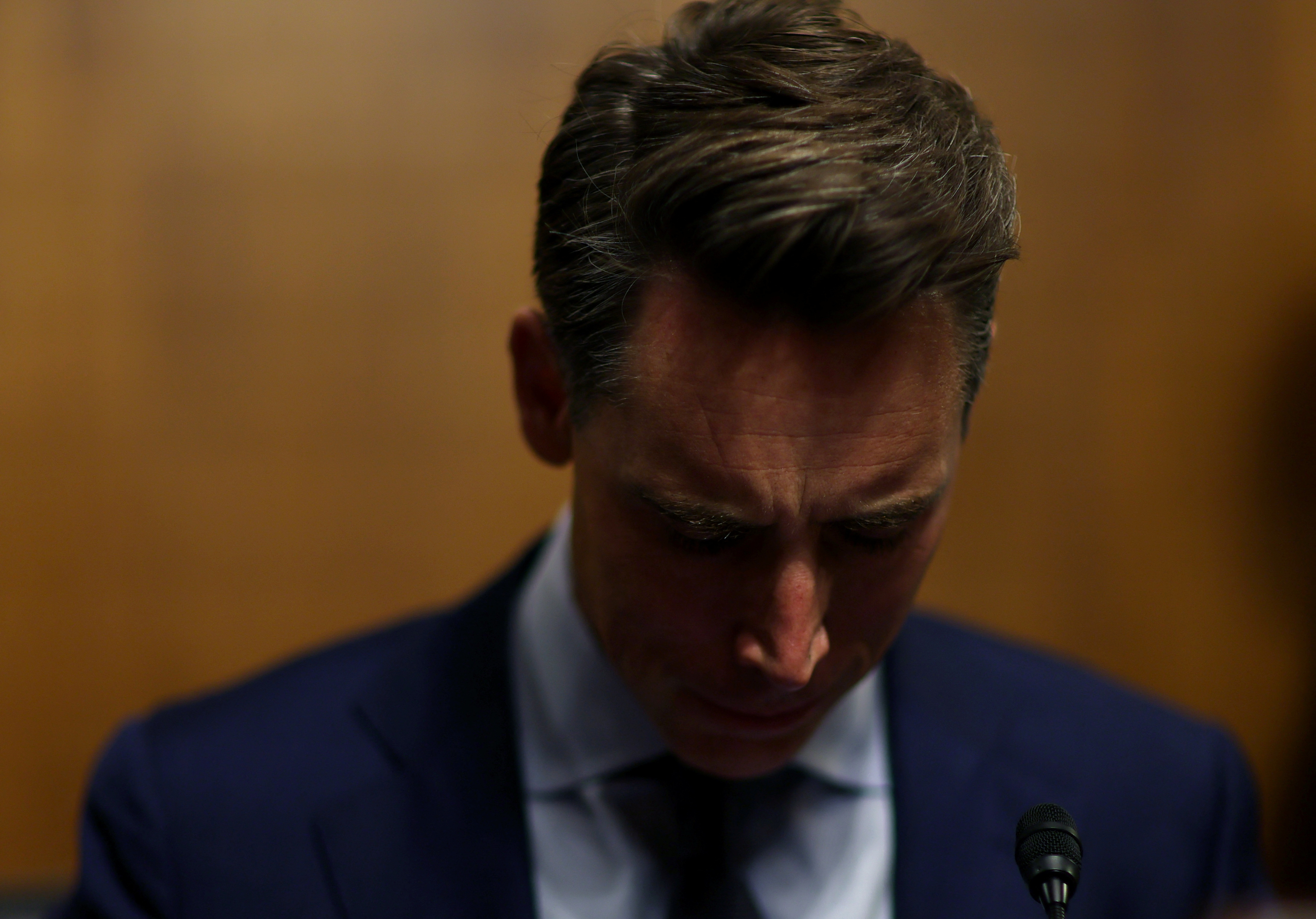U.S. Sen. Josh Hawley (R-MO) gets situated before a Senate Judiciary Privacy, Technology, and the Law Subcommittee hearing on "Oversight of A.I.: Legislating on Artificial Intelligence" featuring Microsoft President Brad Smith, Nvidia's chief scientist William Dally, and Professor Woodrow Hartzog on Capitol Hill in Washington, U.S., September 12, 2023.