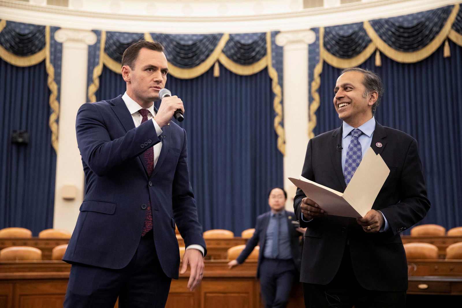 Committee chairman U.S. Rep. Mike Gallagher (R-WI) and U.S. Rep. Raja Krishnamoorthi (D-IL) talk over procedures with their members during a House Select Committee on the Strategic Competition Between the United States and the Chinese Communist Party meeting on "Taiwan Tabletop Exercise (TTX)," a war games simulation, on Capitol Hill in Washington, U.S., April 19, 2023. 