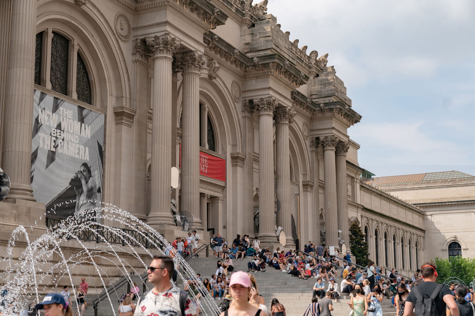 People stand outside The Metropolitan Museum of Art in New York City, New York, U.S., July 11, 2021. 