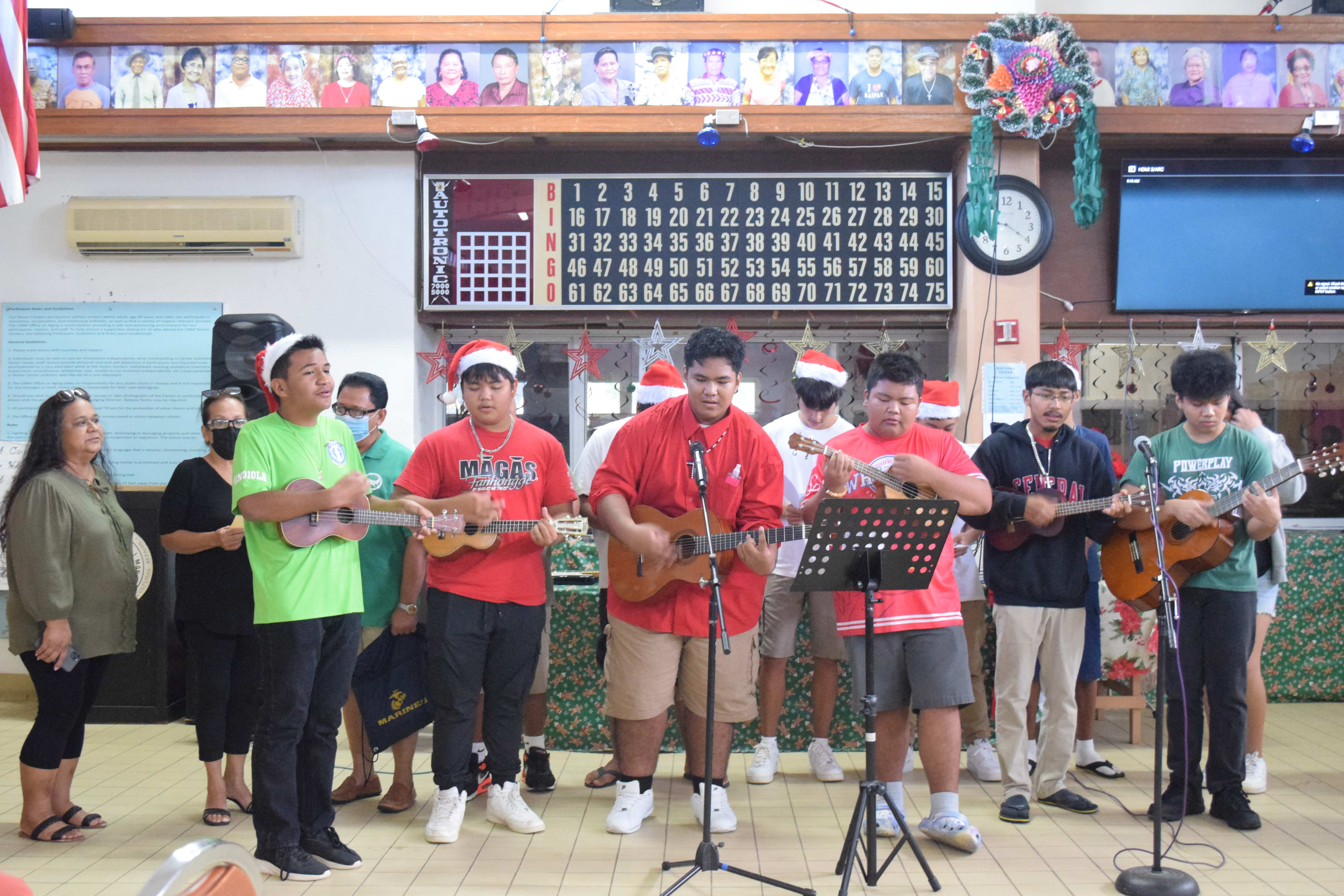 Members of the Famago'un Marianas of Saipan Southern High School perform Chamorro Christmas carols at the manamko' center on Friday.