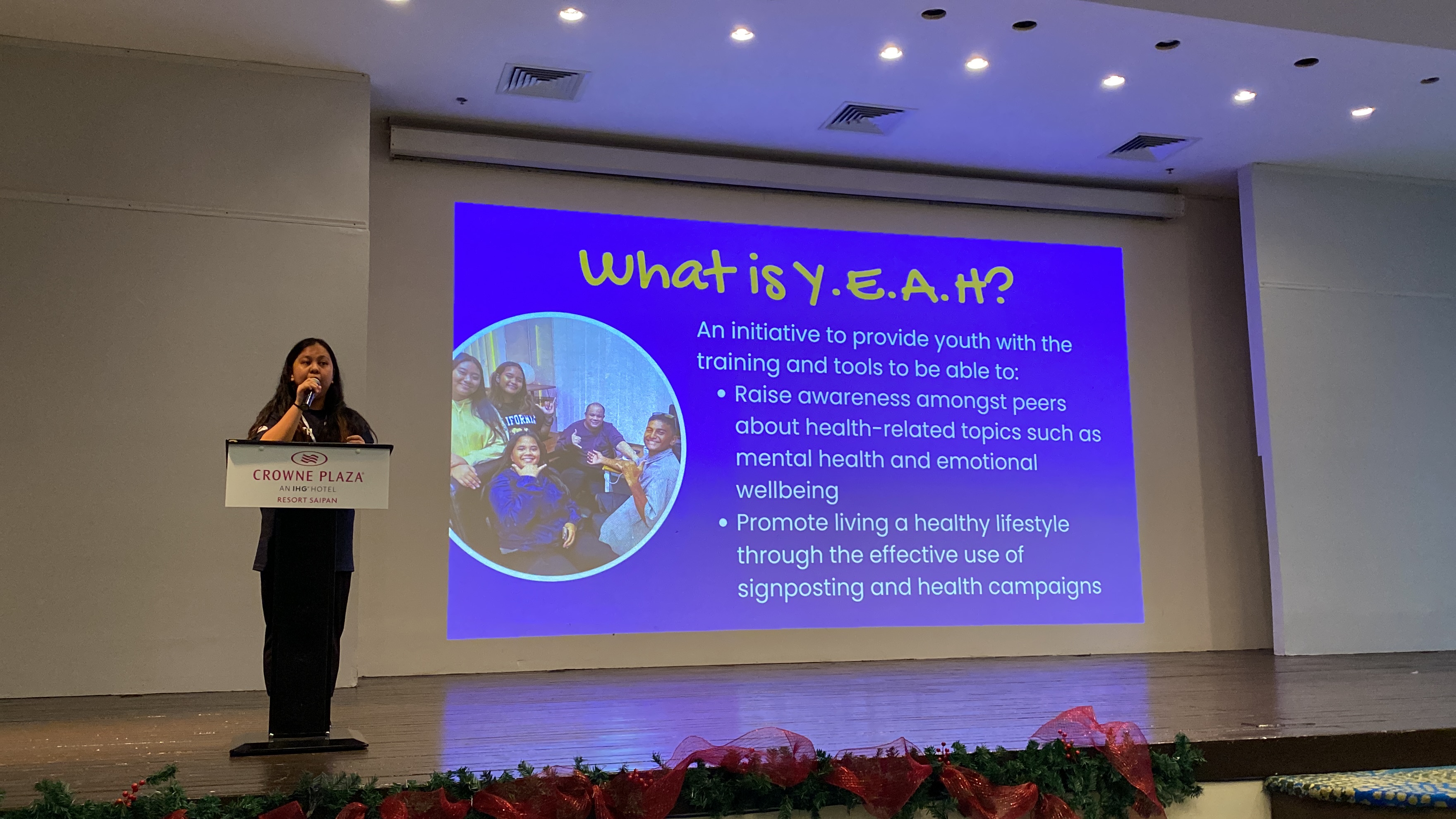 Youth Empowerment Action for Health facilitator Eloise Lopez delivers her remarks on Saturday, Dec. 9 at the Crowne Plaza Resort. Photo by Andrew Roberto