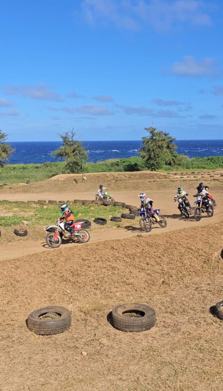 Riders execute the tight turn in a battle for the lead during the Power Puff Girls and Women's Class race of the 2023 Annual Turkey Cross held over the Thanksgiving weekend at the Cow Town Raceway Park.