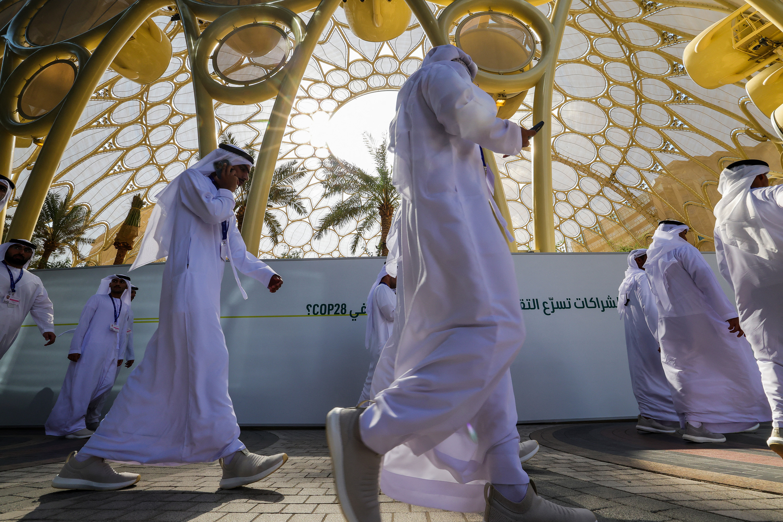 Participants arrive at the venue of the COP28 United Nations climate summit in Dubai on Nov. 29, 2023. (Giuseppe Cacace/AFP/Getty Images/TNS)