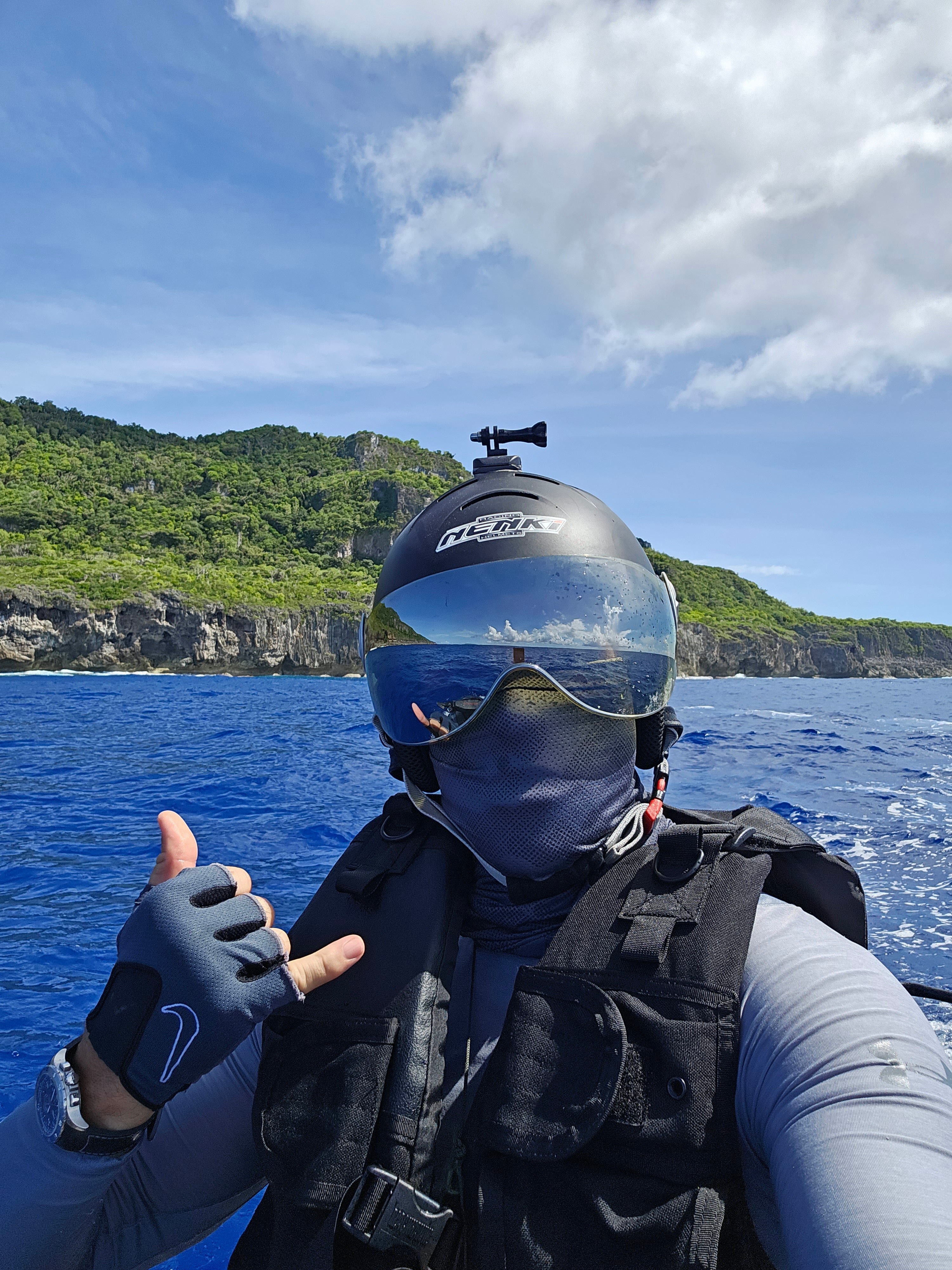 Vlad Melnik throws a shaka off the coast of Goat Island.