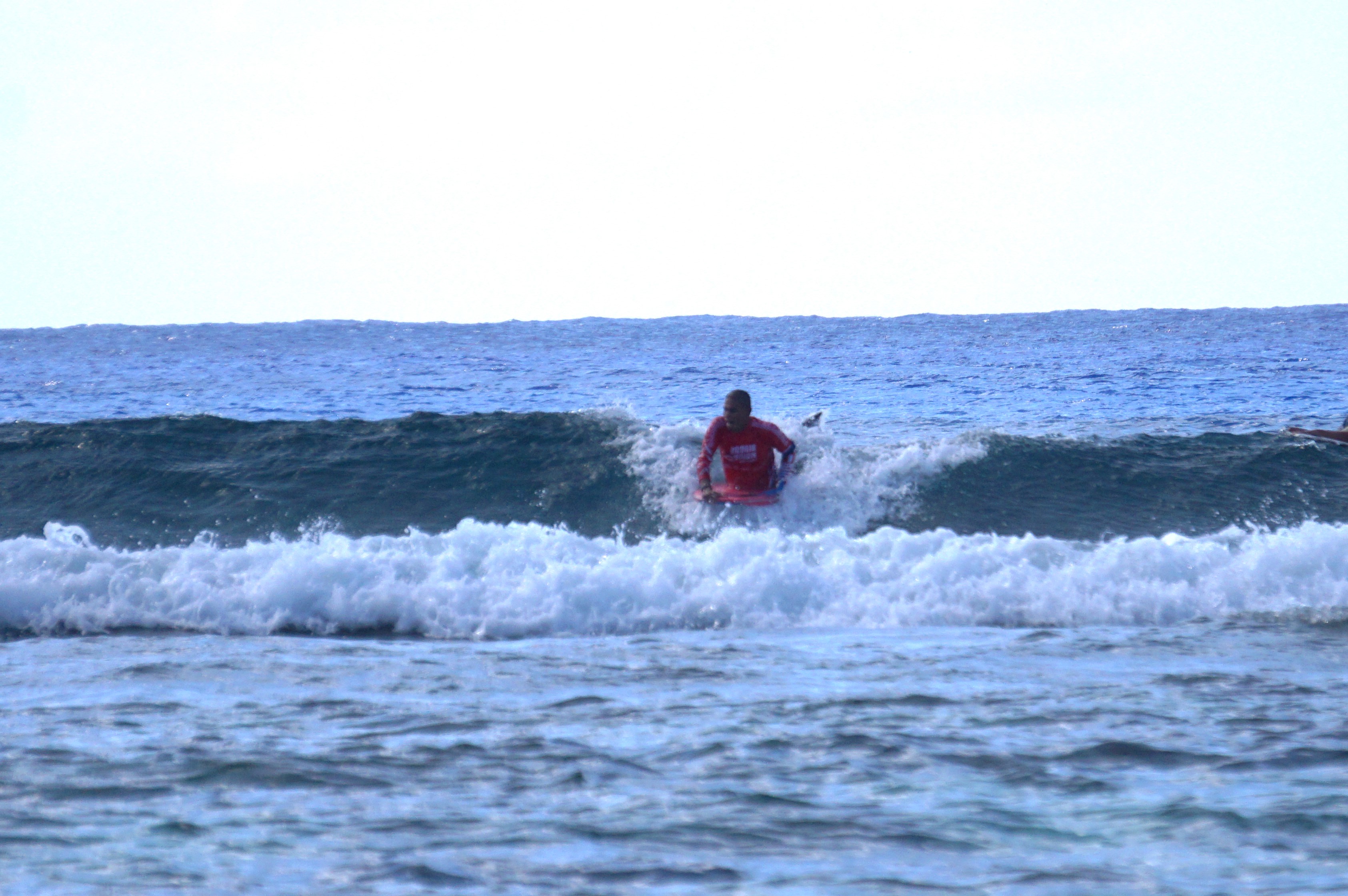 Vincent Villagomez, this year’s winner, sets up to ride the incoming wave.