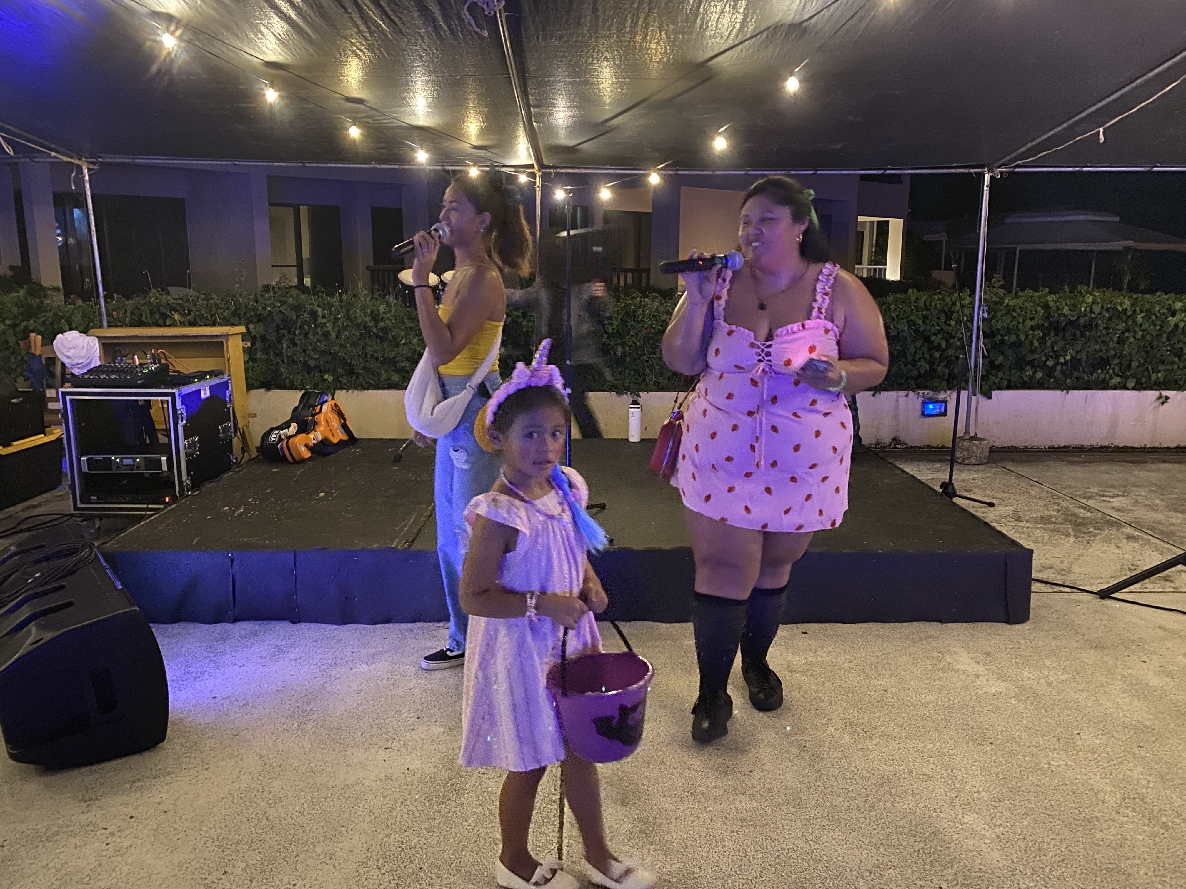 Local Girls Marianas cofounders Ashley Pangelinan, left, and Tiara Deleon Guerrero, host a children's costume contest during the Halloween-themed Mini Night Market at Aqua Resort Club on Oct. 26, 2023.