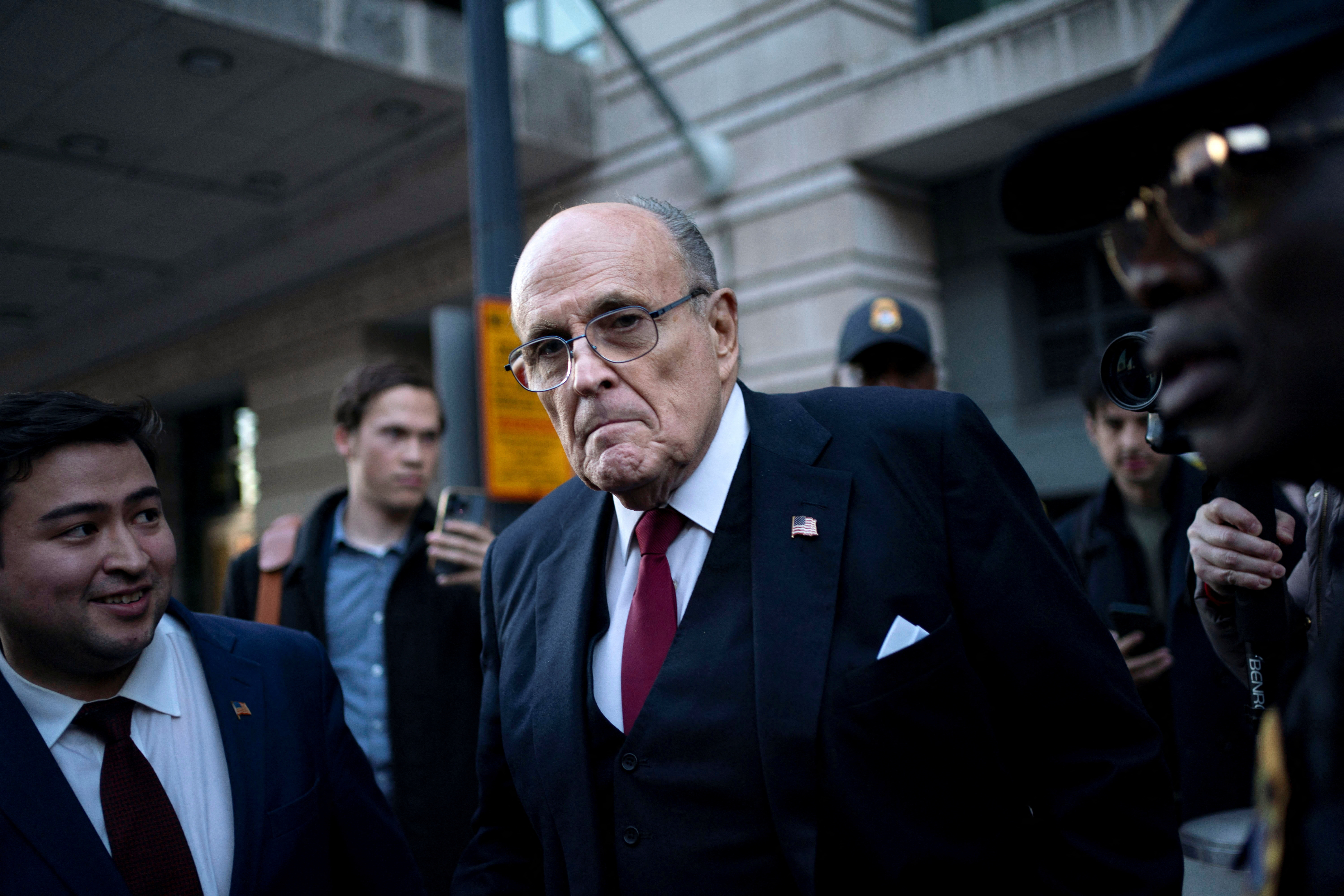Former New York Mayor Rudy Giuliani departs the U.S. District Courthouse after he was ordered to pay $148 million in his defamation case in Washington, U.S., December 15, 2023. 