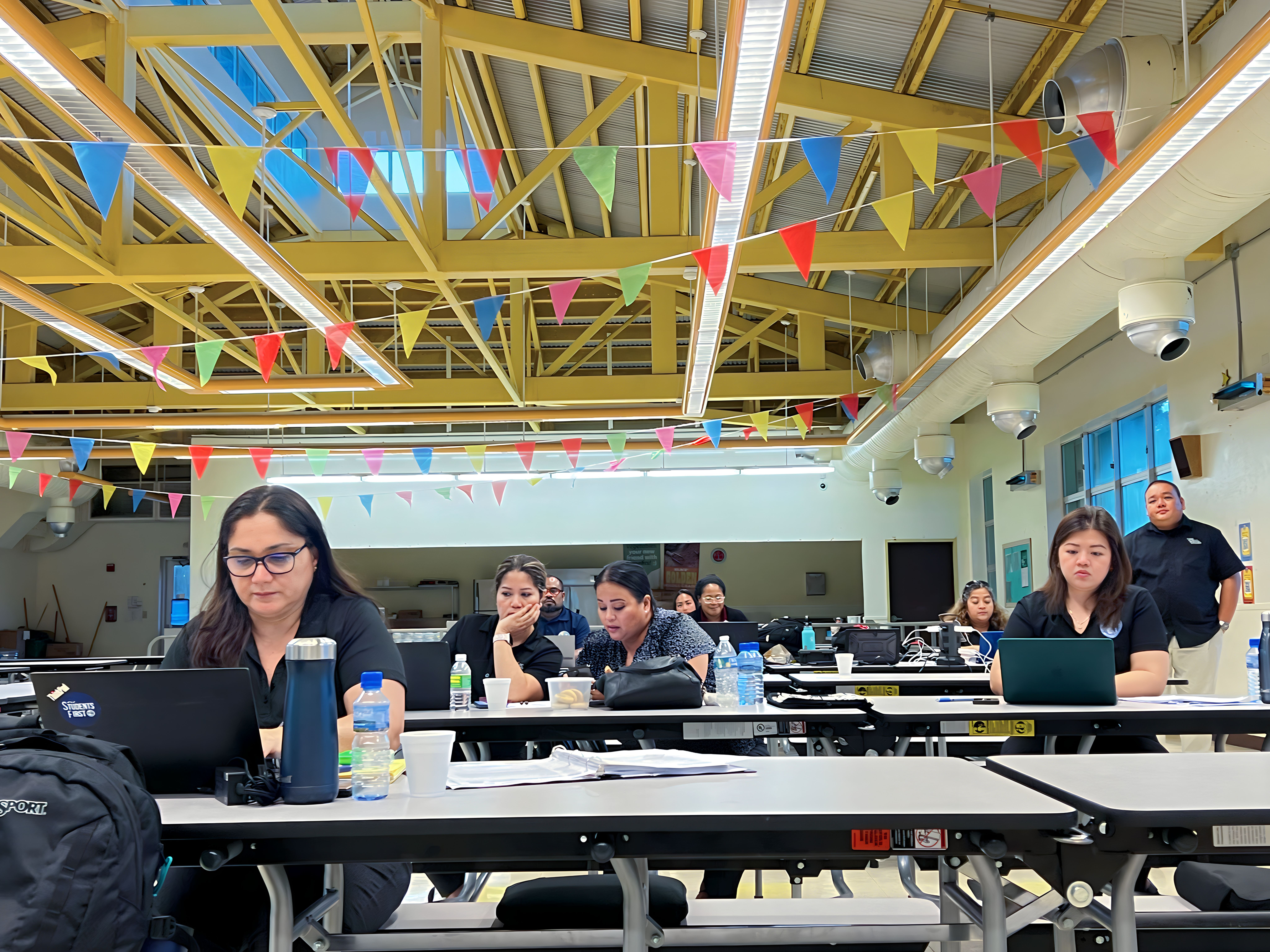 Interim Commissioner of Education Donna M. Flores with Associate Commissioner for Administrative Services Eric Magofna, Federal Programs Officer Jacqueline Che, Human Resources Officer Lucretia B. Deleon Guerrero, and Finance and Budget Director Arlene Lizama  attend the Board of Education meeting in the cafeteria of Sinapalo Elementary School on Rota, Monday.