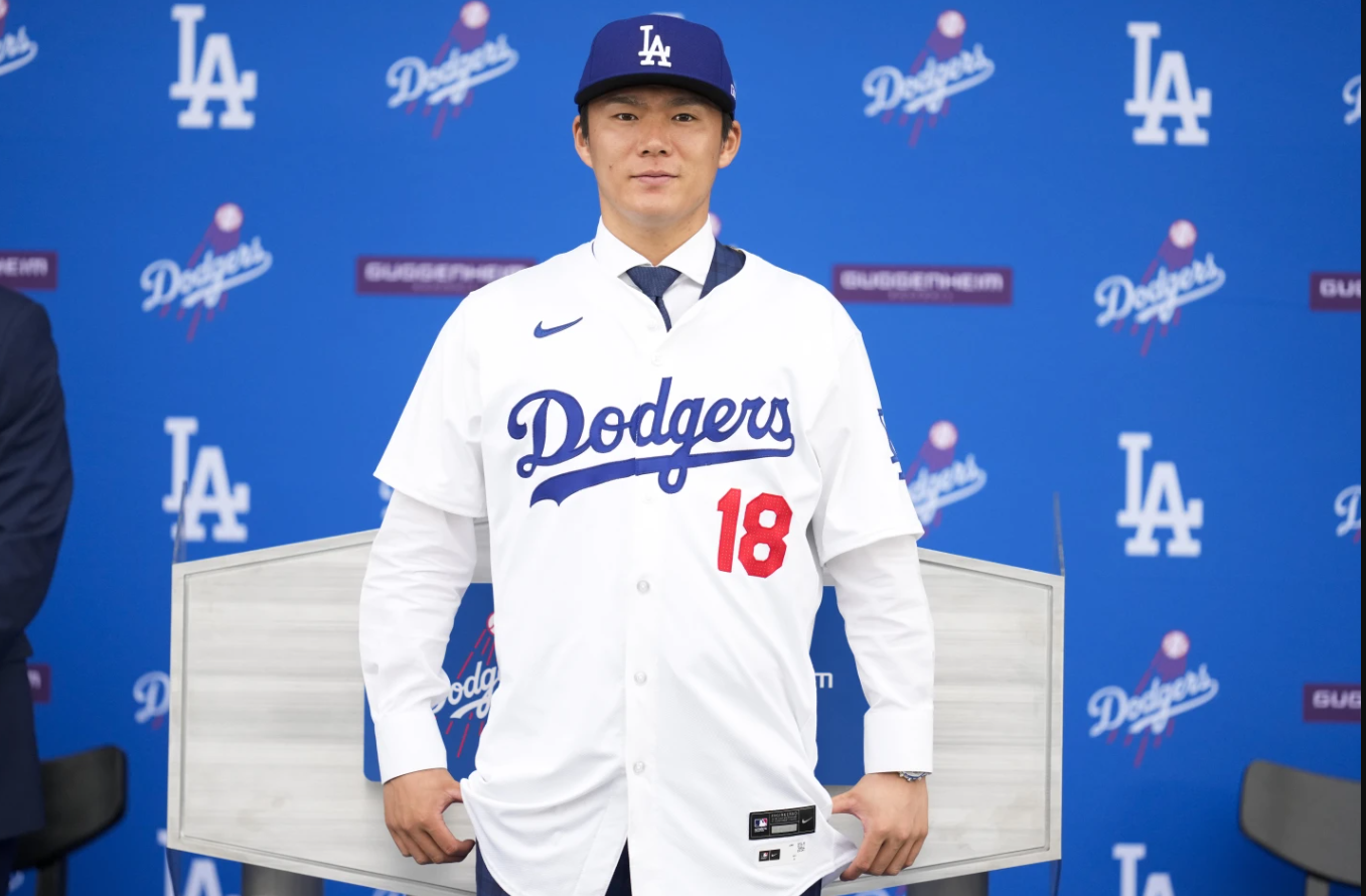 Yoshinobu Yamamoto wears his jersey during his introduction as a new member of the Los Angeles Dodgers on Wednesday, Dec. 27, 2023 in Los Angeles.