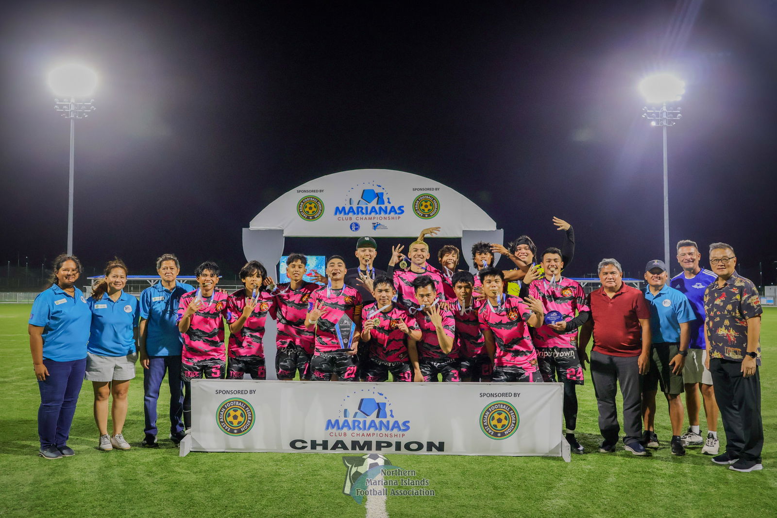 Eleven Tiger Football Club members pose with the Marianas Club Championship trophy after defeating the Wings Football Club at the NMI Soccer Training Center in Koblerville on Saturday.