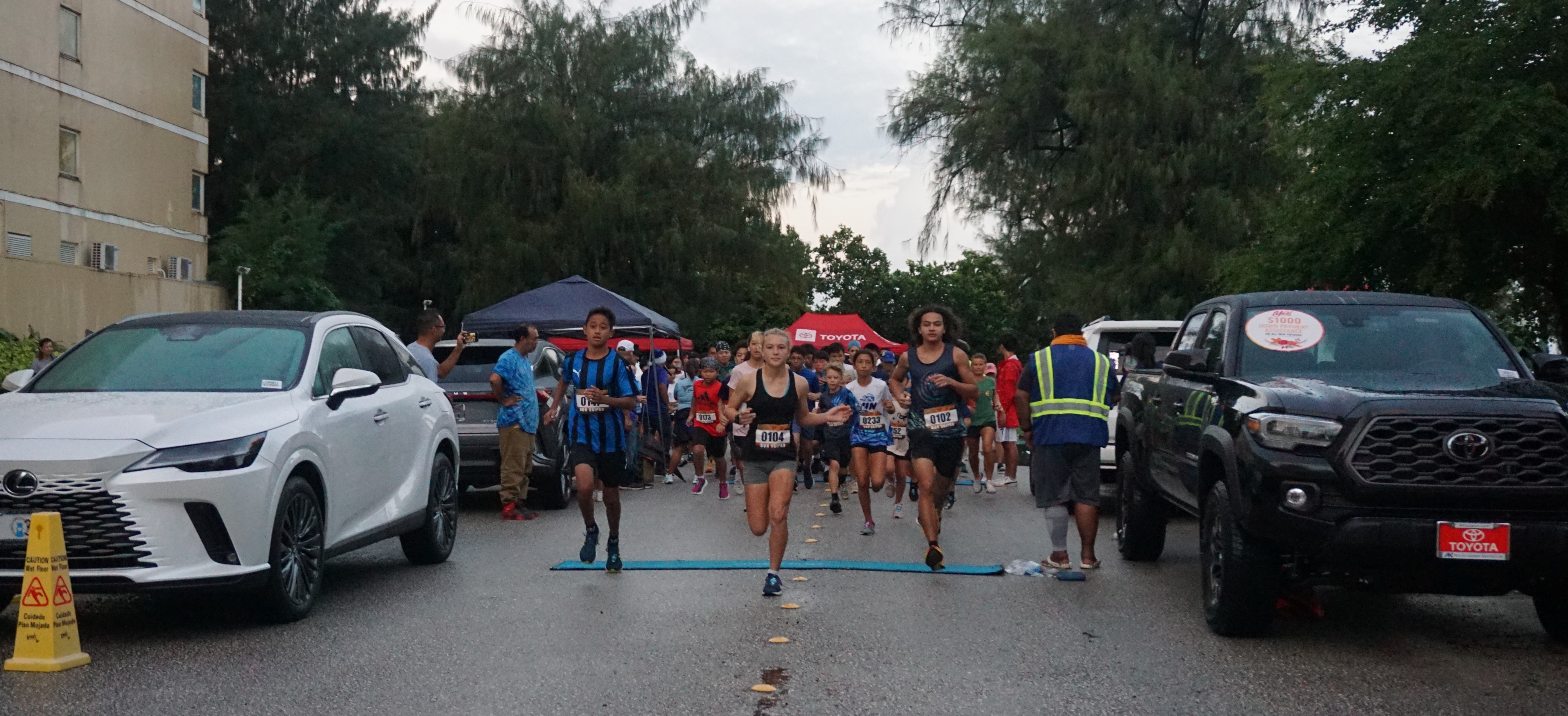 Runners take off from the starting point of the AK 5K Fun Run on Saturday at Micro Beach.
