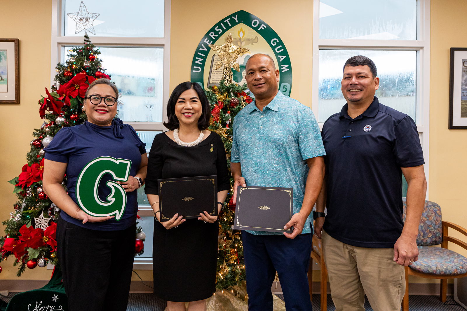 University of Guam officials signed a memorandum of understanding on Nov. 27, 2023, with Cabras Marine Corp. to open paid internships for qualified UOG students. From left, Dr. Sharleen Santos-Bamba, UOG interim senior vice president and provost; Dr. Anita Borja Enriquez, UOG president; Joseph L. Cruz, president, Cabras Marine Corp.; and Wayne Bigler, human resources director, CMC at the signing at UOG.