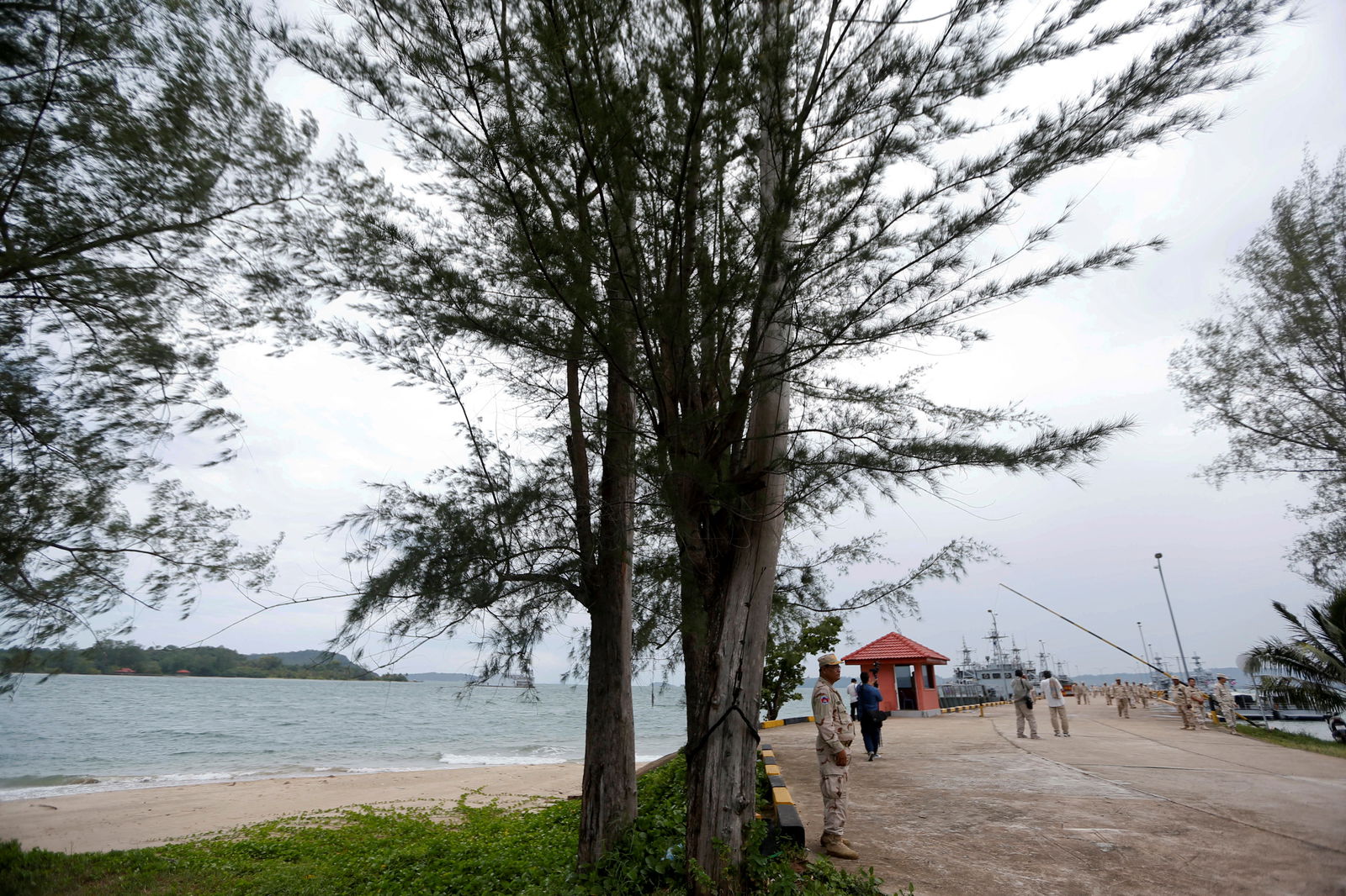 Sailors stand guard near petrol boats at the Cambodian Ream Naval Base in Sihanoukville, Cambodia, July 26, 2019. 