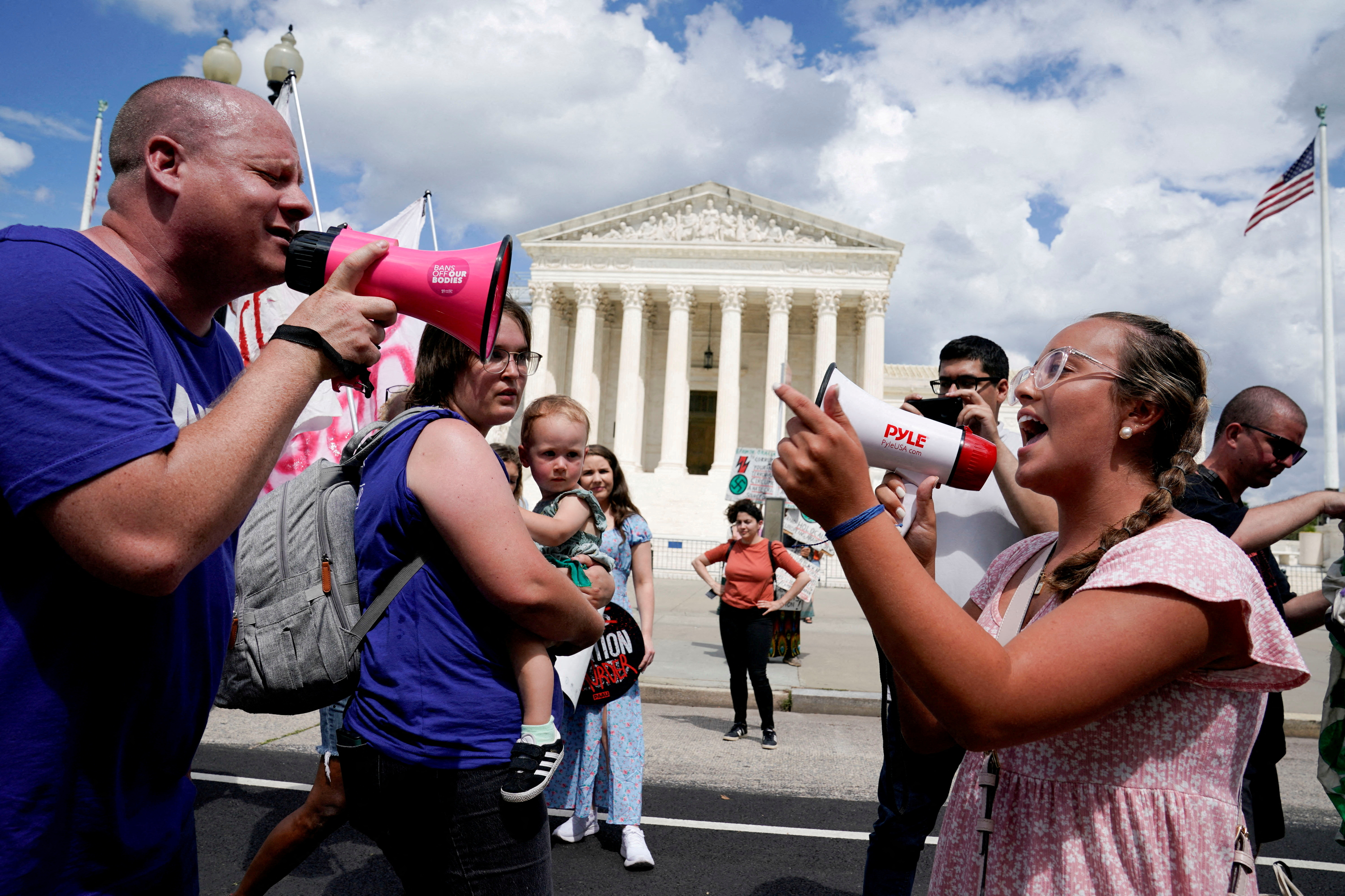 Abortion rights activists and counter protesters protest outside the U.S. Supreme Court on the first anniversary of the court ruling in the Dobbs v Women's Health Organization case, overturning the landmark Roe v Wade abortion decision, in Washington, U.S., June 24, 2023. 