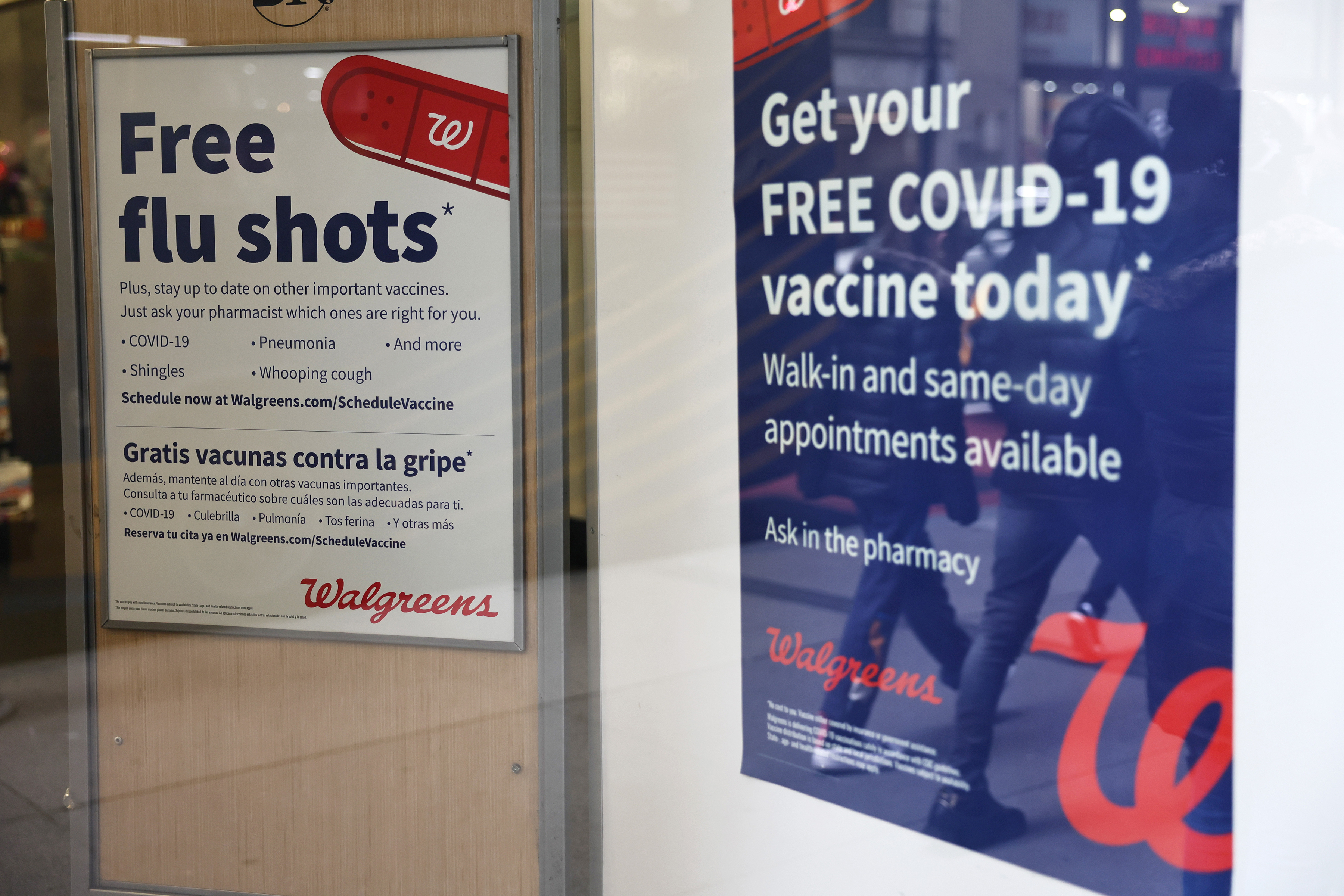 Flu and COVID-19 vaccine signage is seen at a Duane Reade store on Jan. 5, 2023, in New York. (Michael M. Santiago/Getty Images/TNS)
