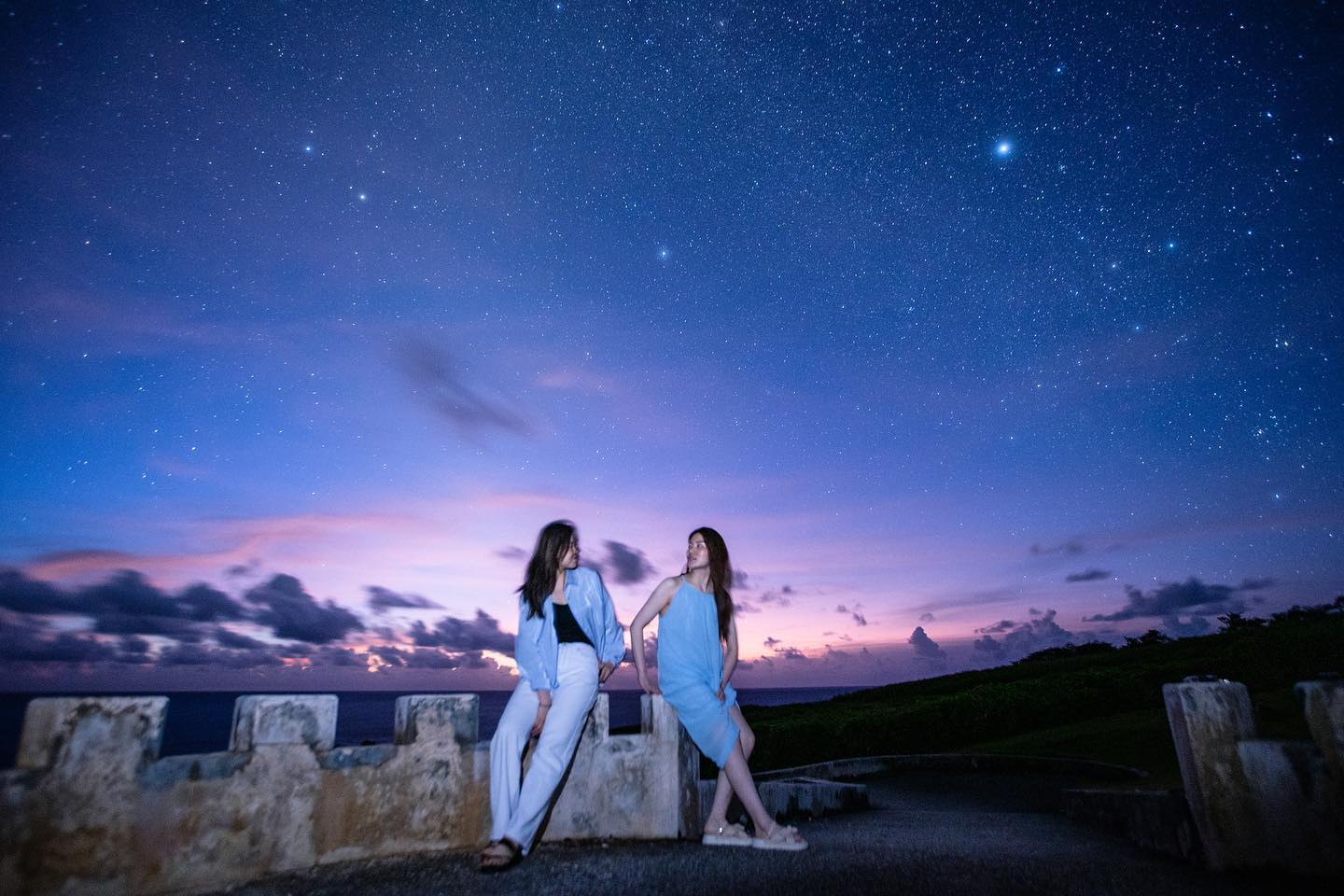 Under the stars, Zhang's clients strike a pose.