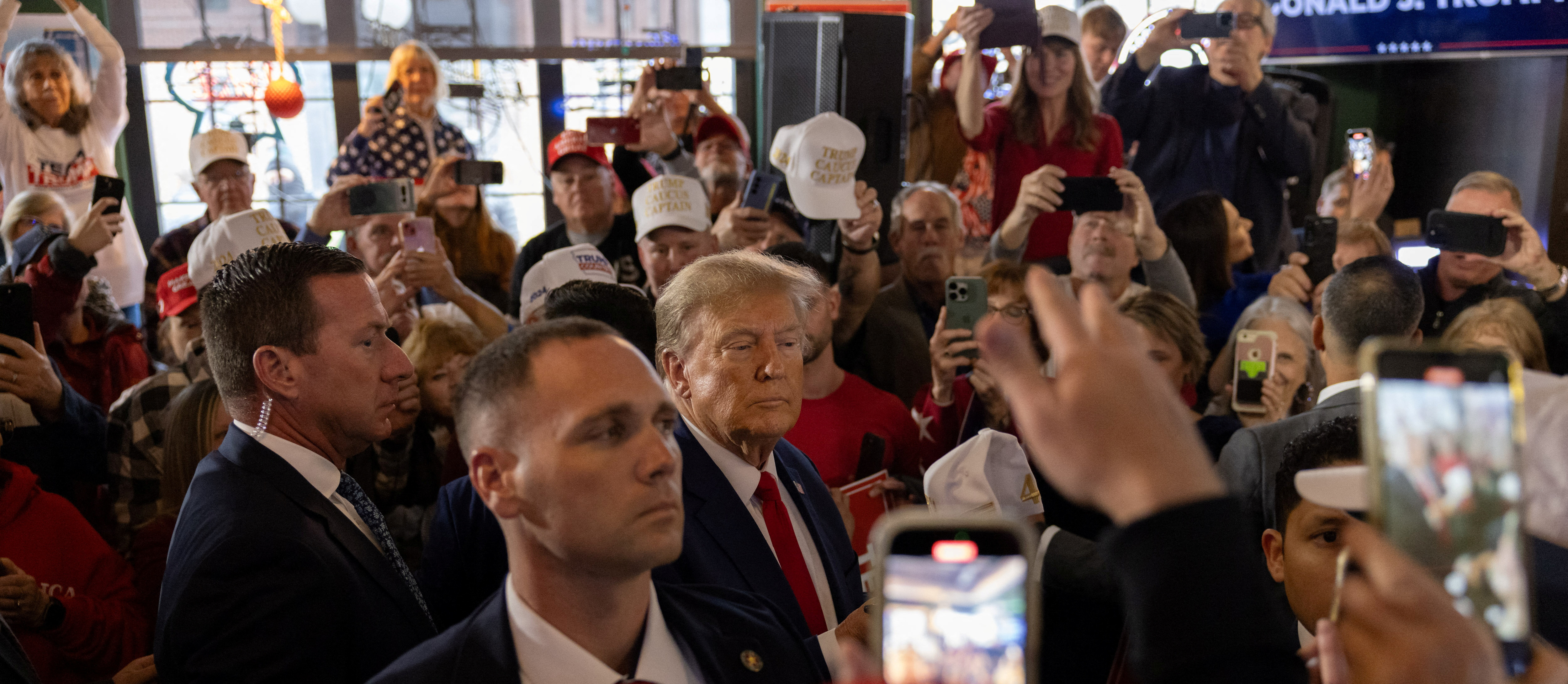 Former U.S. President and Republican presidential candidate Donald Trump rallies with supporters at a "commit to caucus" event at a Whiskey bar in Ankeny, Iowa, U.S. December 2, 2023. 