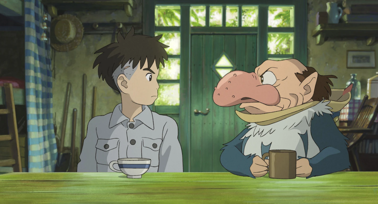 Mahito Maki, voiced by Luca Padovan in English and Soma Santoki in Japanese, left, and Grey Heron, voiced by Robert Pattinson in English and Masaki Suda in Japanese, in a scene from Hayao Miyazaki’s “The Boy and the Heron.”