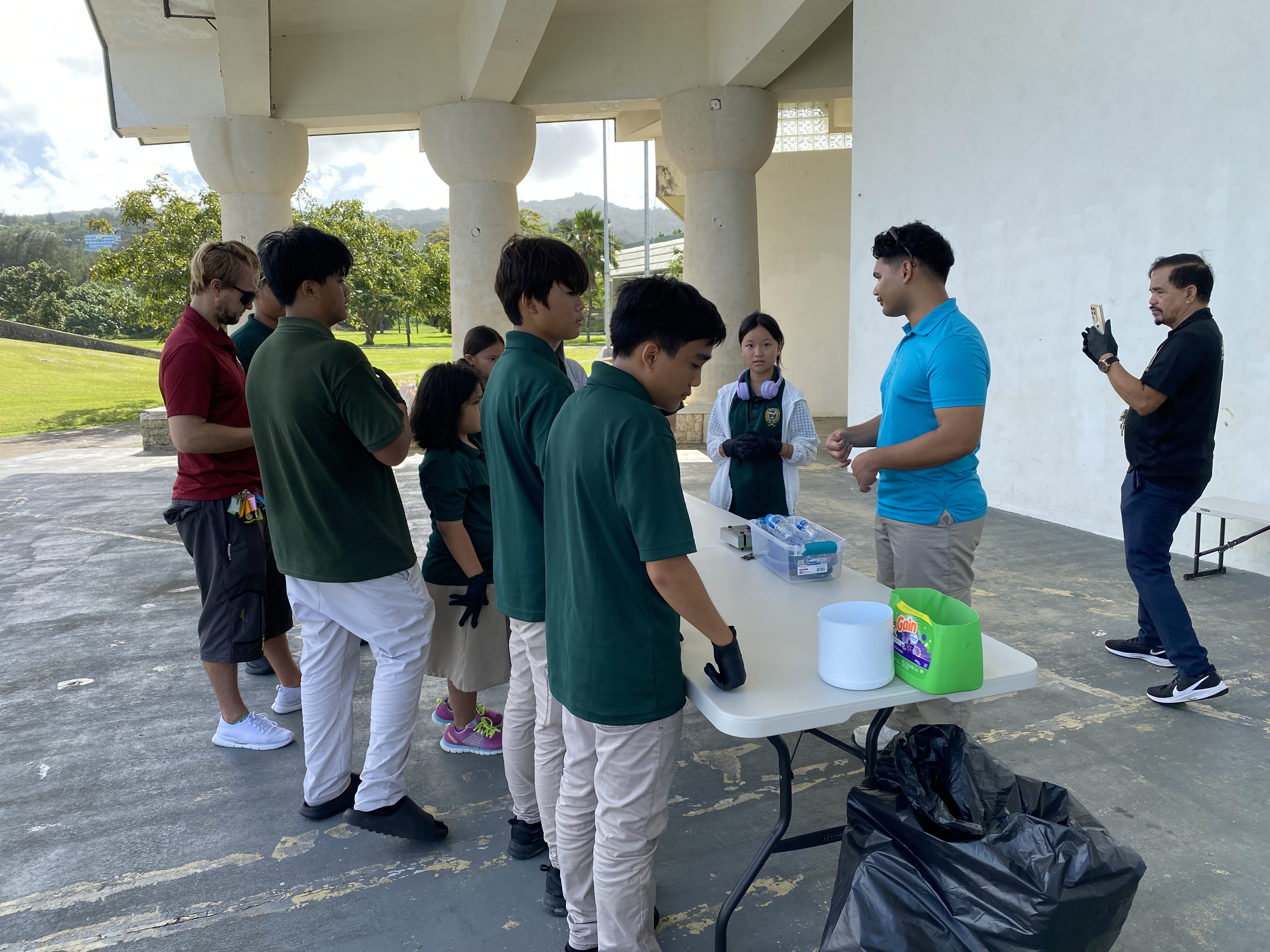 Joseph Nekaifes with Seventh-day Adventist School students at a plastics workshop.