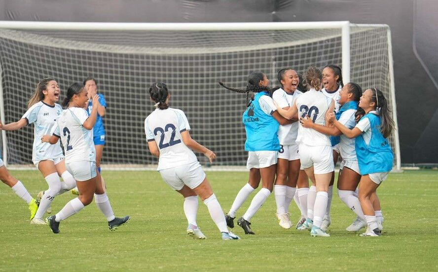 NMI women’s soccer players celebrate after scoring a goal against Mongolia on Thursday in the preliminary competition of the Women’s EAFF E-1 Football Championship  in Zhuhai, China.