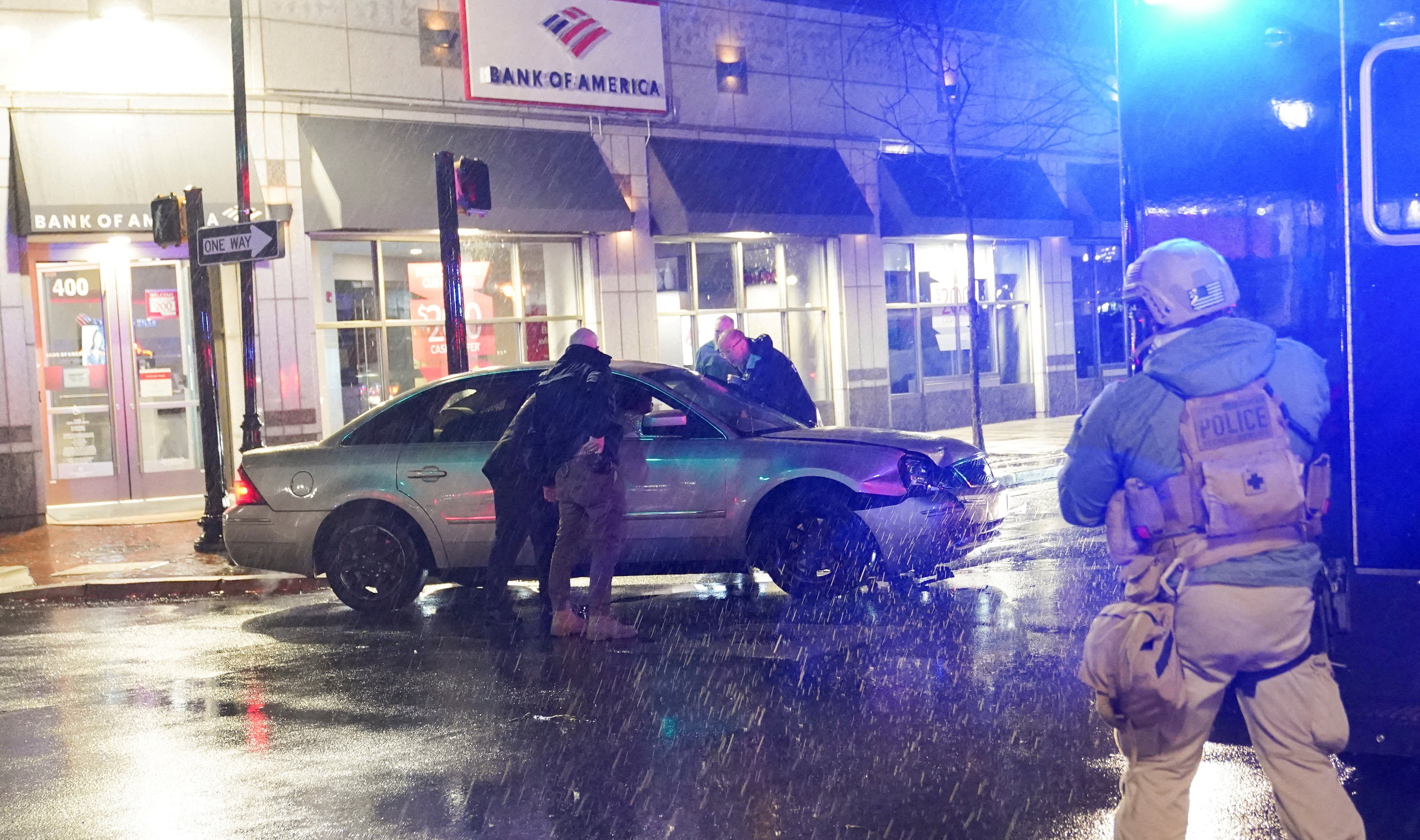 Members of the United States Secret Service react to a vehicle crashing into a Secret Service SUV that was blocking the street as U.S. President Joe Biden exited his campaign headquarters, in Wilmington, Delaware, U.S. December 17, 2023. 