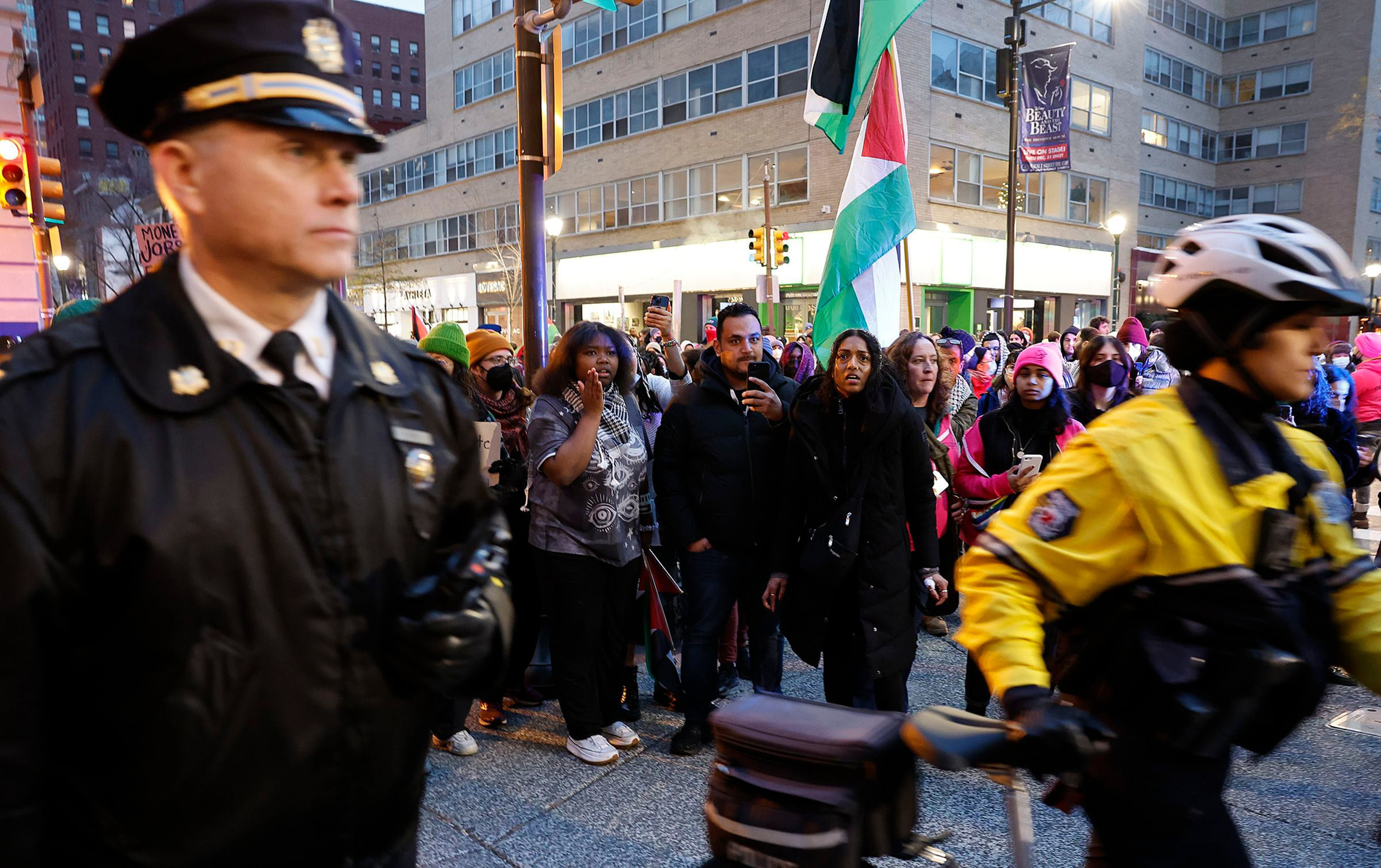 Pro-Palestinian supporters watch the Philadelphia Police during a cease-fire rally near Rittenhouse Square in Center City on Saturday, Dec. 23, 2023. (Yong Kim/The Philadelphia Inquirer/TNS)