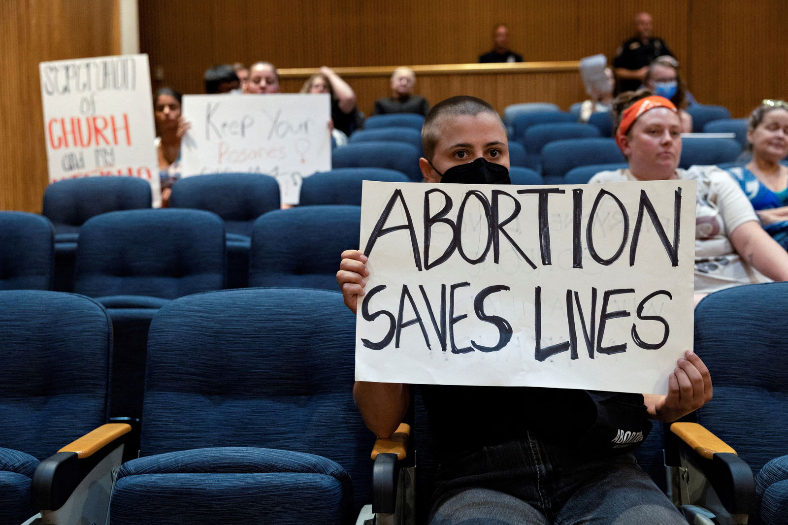 A few abortion rights demonstrators remain in the crowd after hours of public comments and discussion as Denton’s city council meets to vote on a resolution seeking to make enforcing Texas’ trigger law on abortion a low priority for its police force, in Denton, Texas, June 28, 2022. 