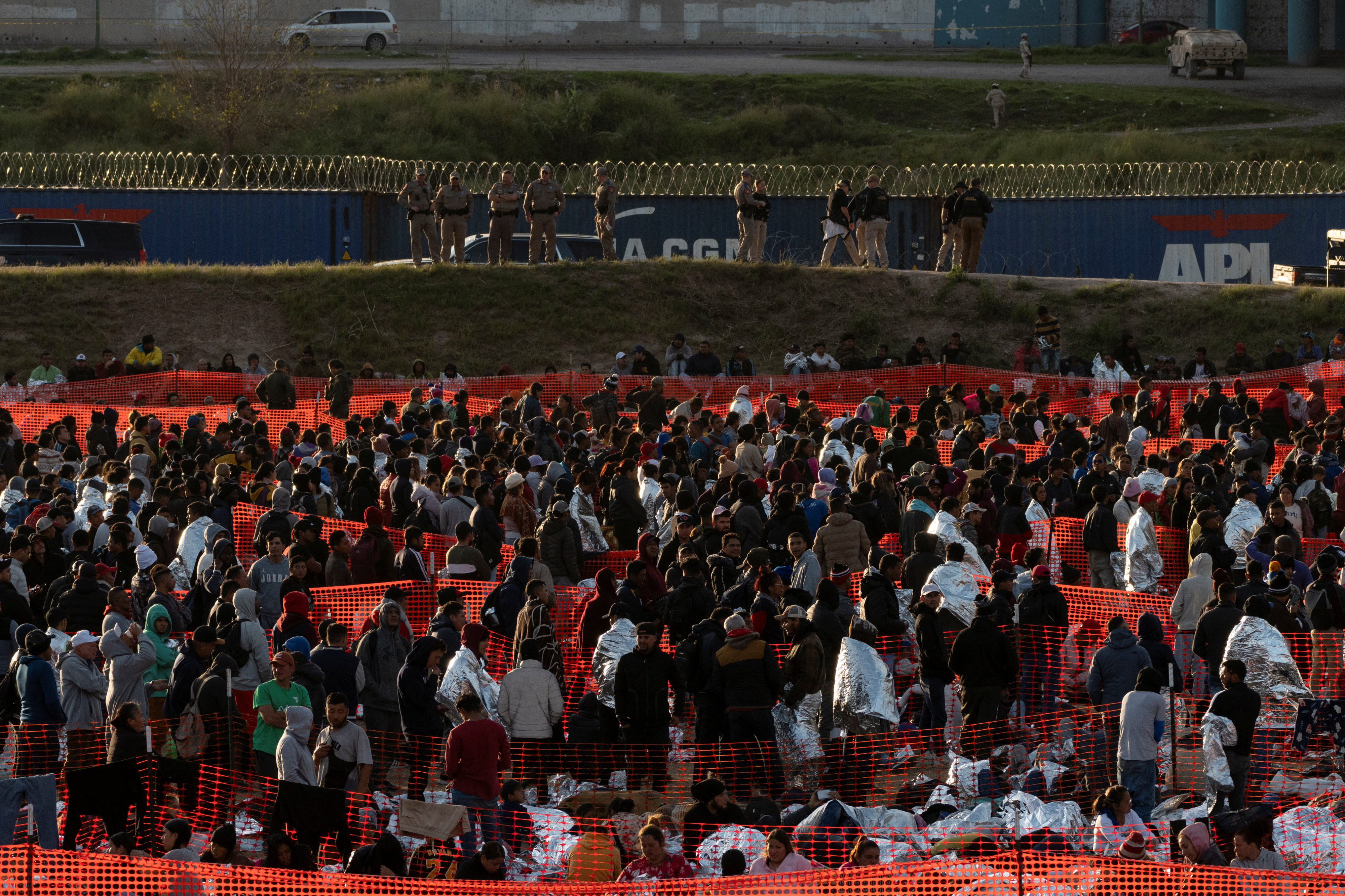 Migrants wait at a processing center in Eagle Pass, Texas, U.S., December 19, 2023. REUTERS/Cheney Orr