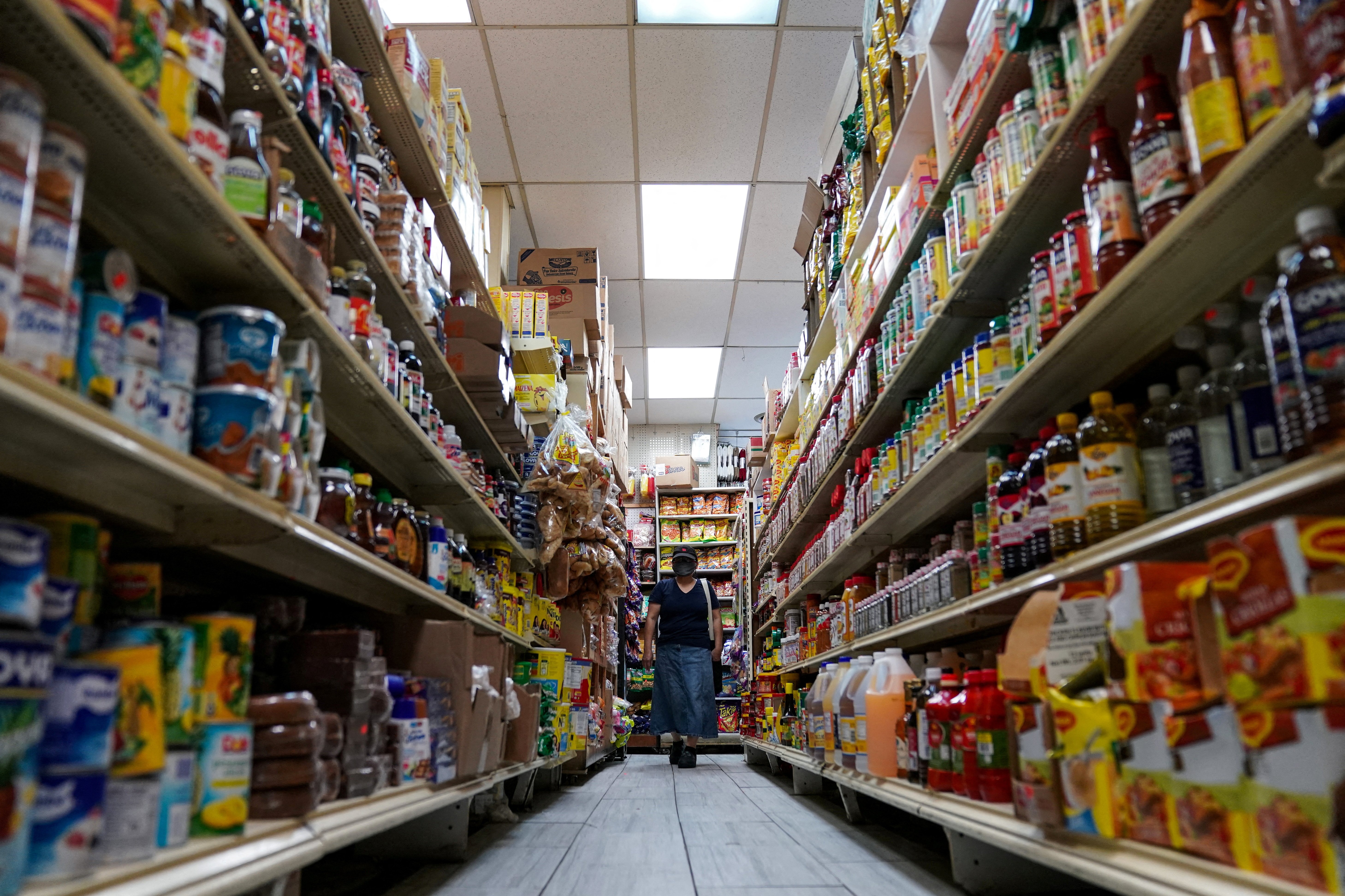A woman shops for groceries at El Progreso Market in the Mount Pleasant neighborhood of Washington, D.C., U.S., August 19, 2022. 