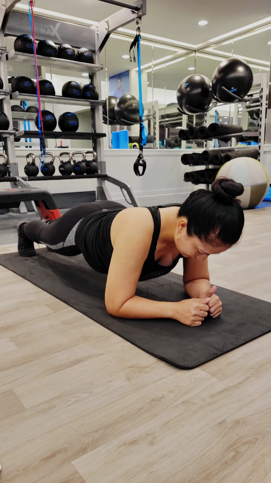 Rose Diaz works out at a Saipan hotel fitness center during a family staycation.