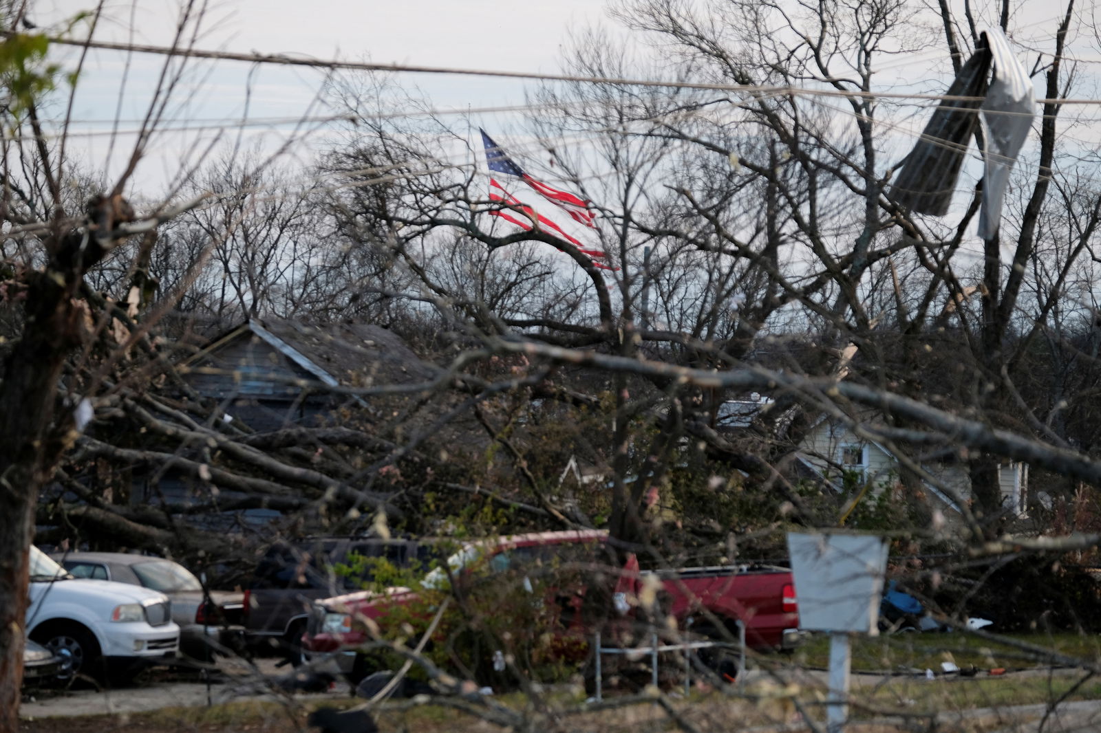 A torn American flag is shown a day after a tornado hit Madison, Tennessee, U.S. December 10, 2023. 