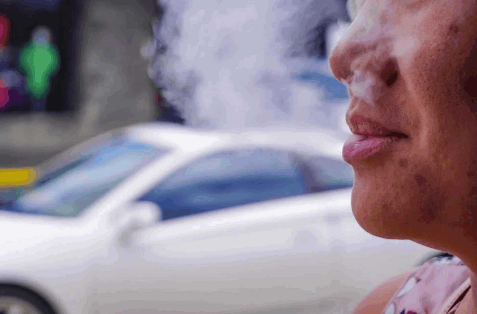 A person can be seen blowing vape smoke Aug. 3, 2022, in Hagåtña. 