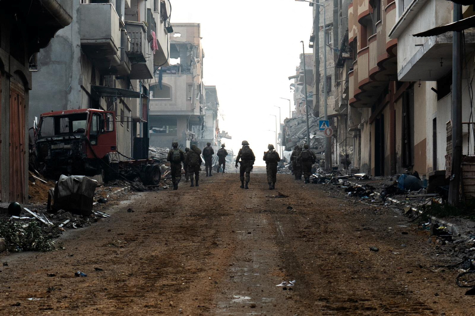 Israeli soldiers operate in the Gaza Strip amid the ongoing conflict between Israel and the Palestinian Islamist group Hamas, in this handout picture released on December 18, 2023. 