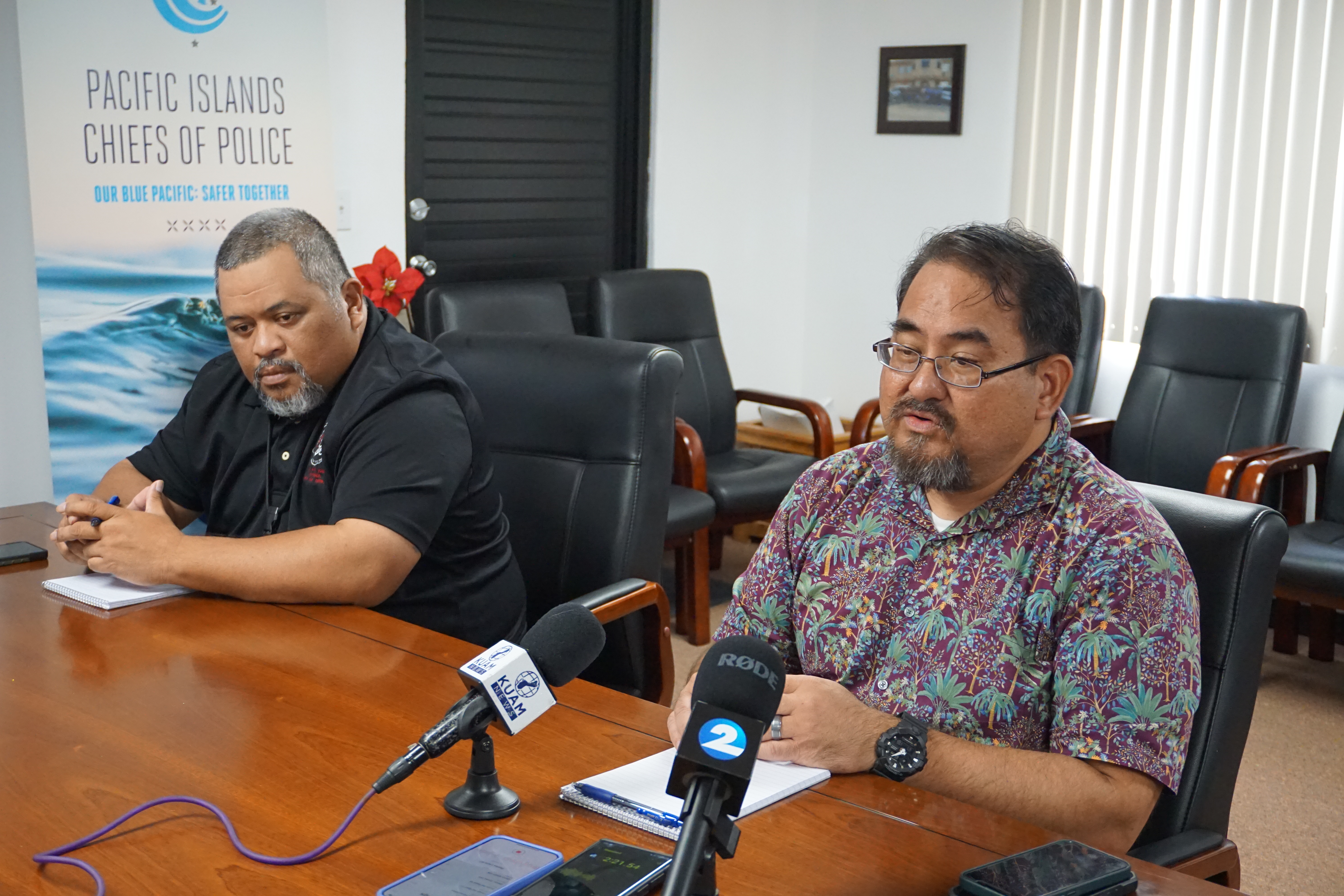 Department of Public Safety Clement Bermudes, right, speaks during a press conference Thursday while Police Sgt. Fred Sato, the DPS public information officer listens.