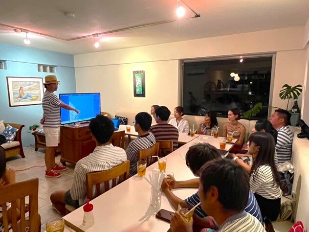 Ten divers from Japan participate in a critique session at Casa Urashima in Saipan  in November 2023 as part of a underwater photography seminar organized by the Marianas Visitors Authority and Marine Diving Web. 
