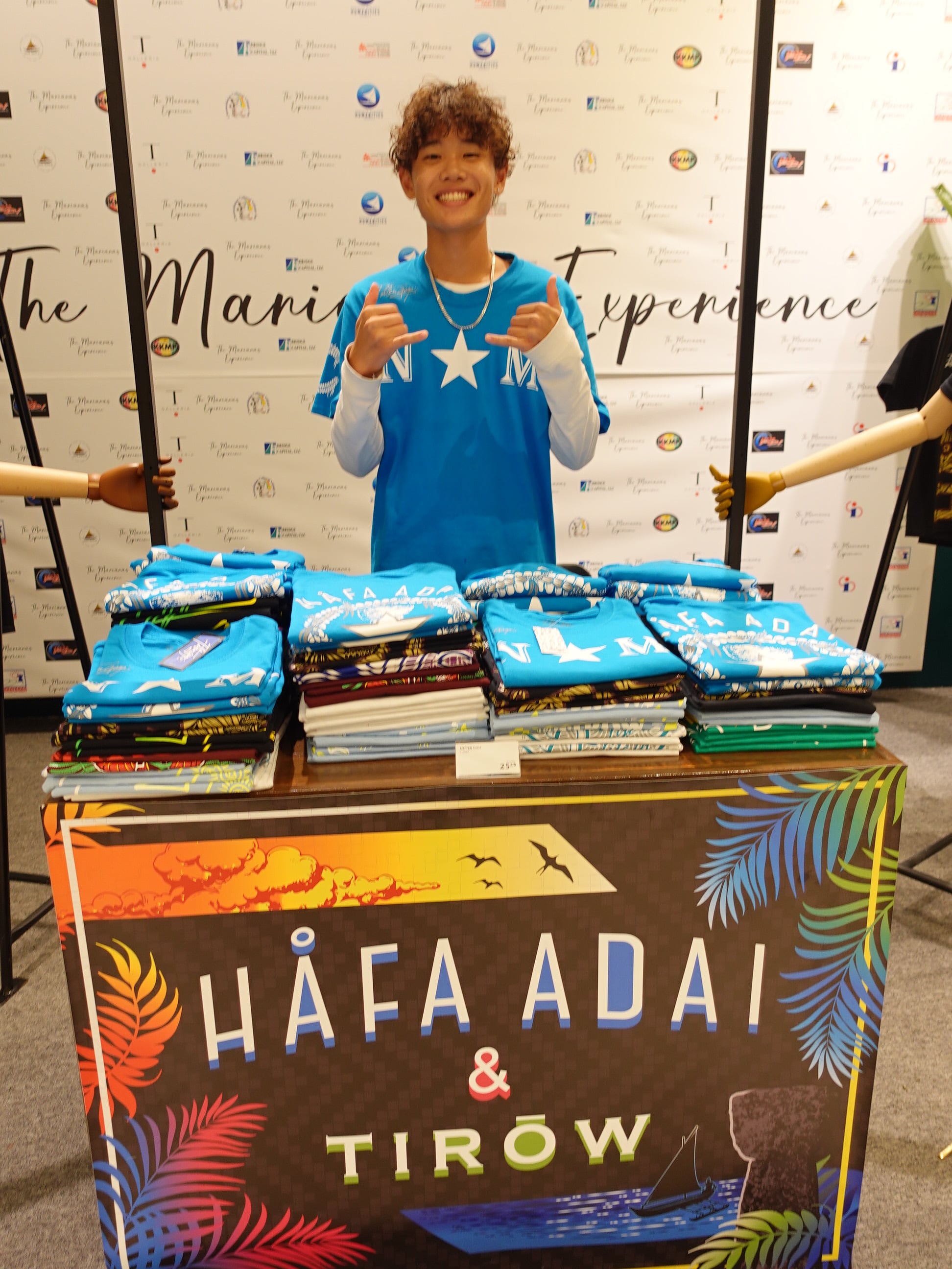 Wataru Kadokura mans the Fotten Gåga’ vendor booth at the 19th Annual Christmas in the Marianas on Dec. 16, 2023, at T Galleria in Garapan, Saipan.