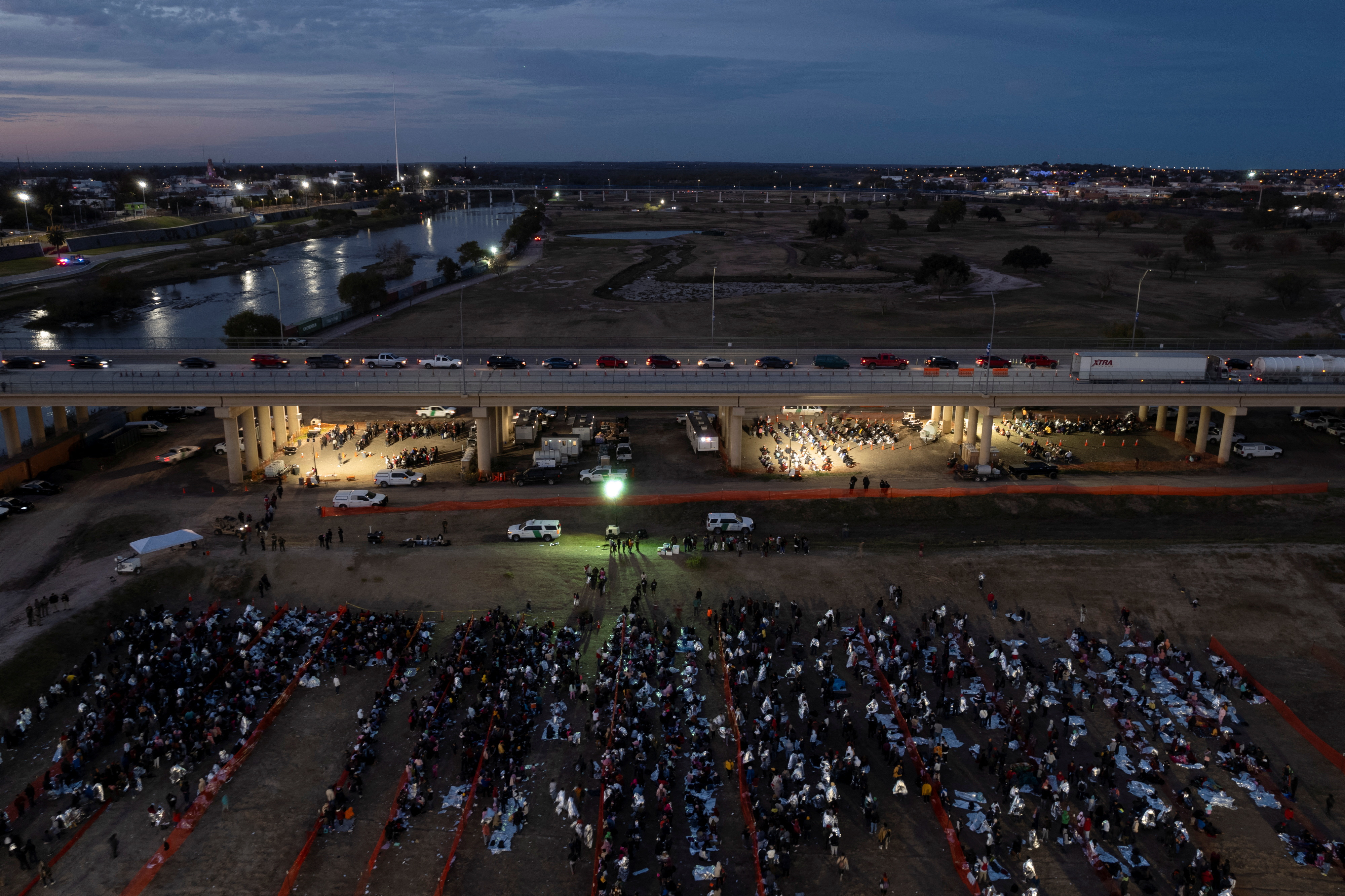 Migrants wait at a processing center in Eagle Pass, Texas, U.S., December 19, 2023. 