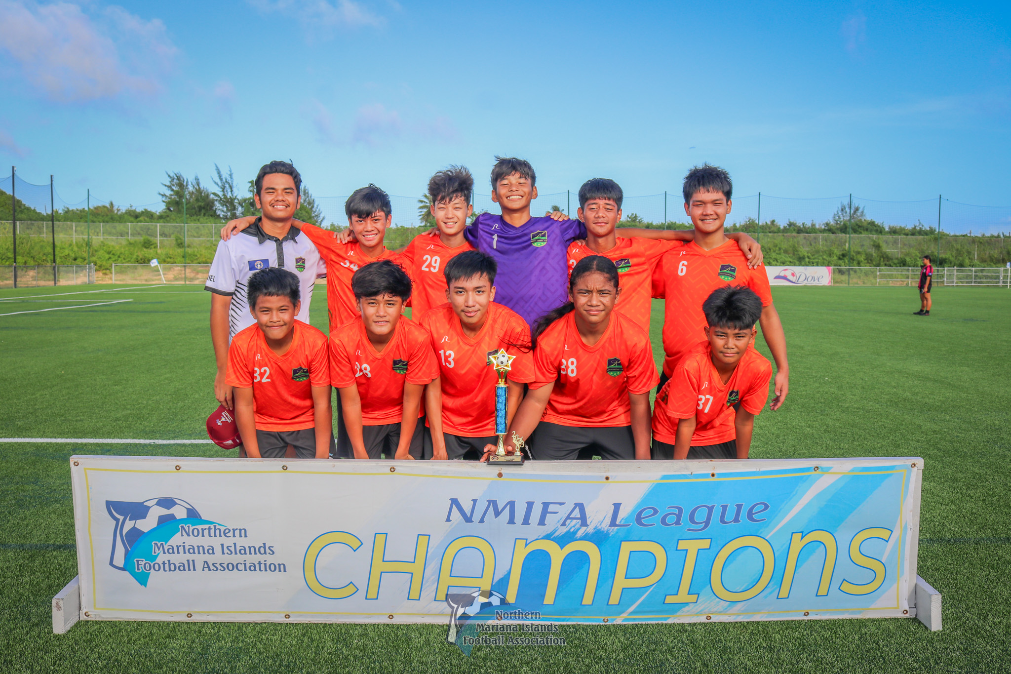 The Kanoa Football Club members pose for a photo after winning the U14 boys division title of the TakeCare Youth Soccer League Fall 2023 on Saturday at the NMI Soccer Training Center in Koblerville.