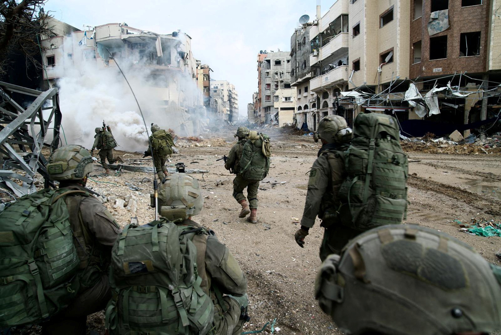 Israeli soldiers operate in the Gaza Strip amid the ongoing conflict between Israel and the Palestinian Islamist group Hamas, in this handout picture released on December 18, 2023. 