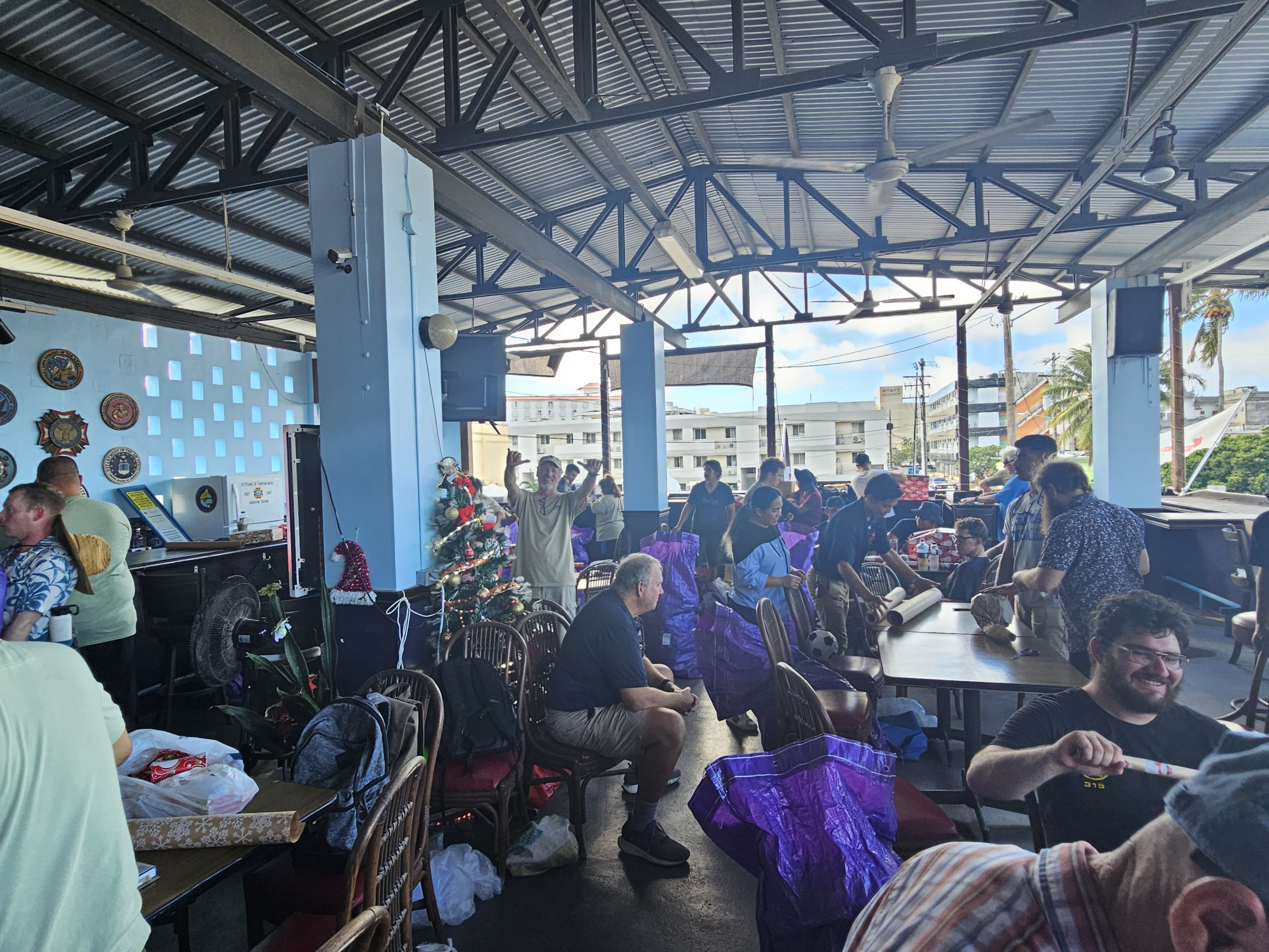 Capt. Michael Bacher and Western Pacific Maritime Academy cadets are photographed after wrapping presents for Guma Esperansa families.